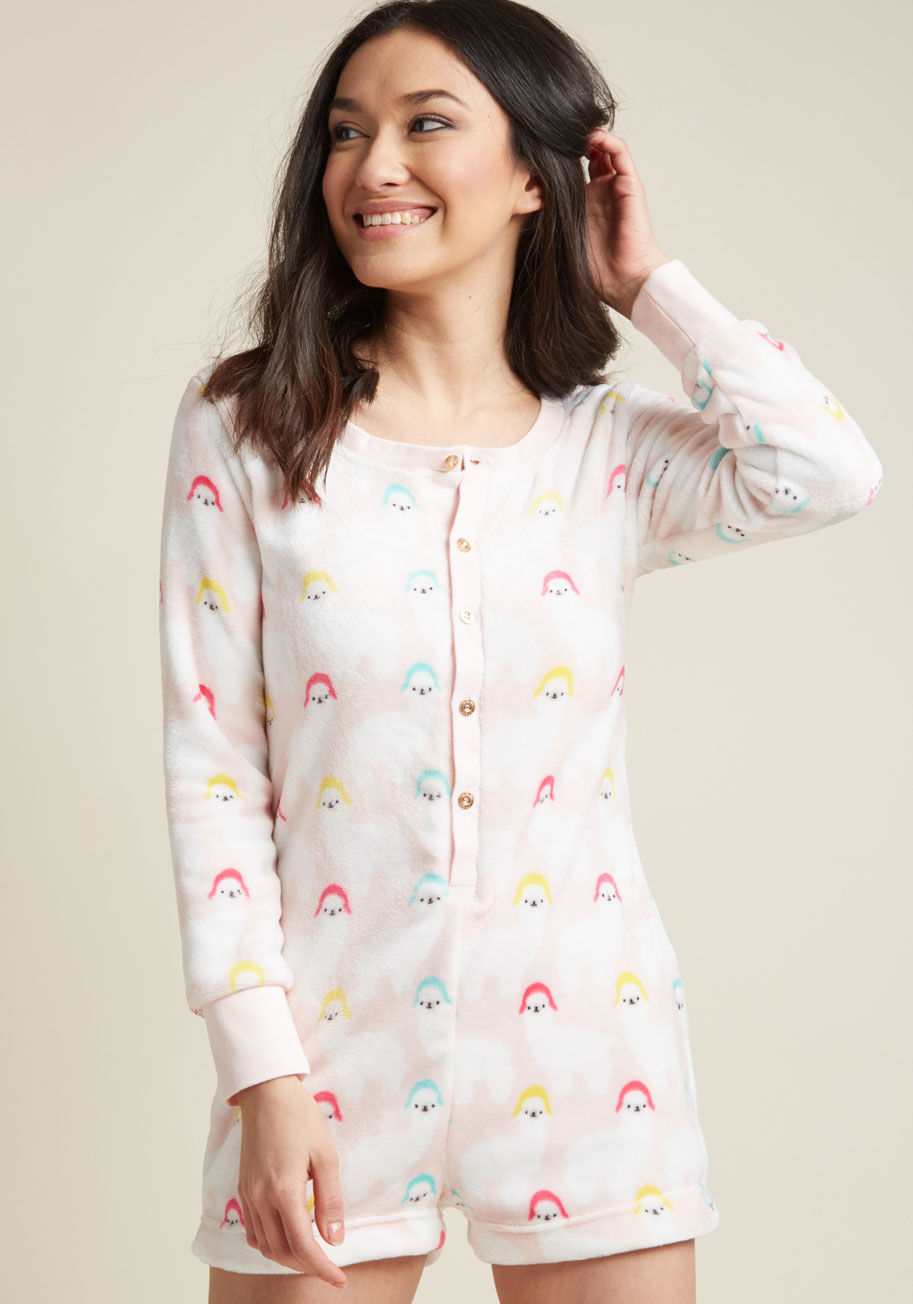 0244-2520PS - Come Saturday night, you'll be the first to call an impromptu slumber party so your cozy fleece romper can be witnessed by all your gals! Fastened up the front with gold buttons and quirkily patterned with hat-wearing alpacas, these one-piece pajamas are 