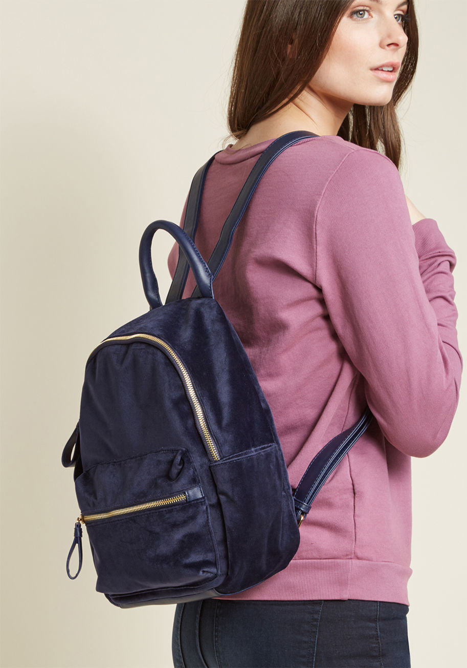 0766-mid size - Some flaunt the boldest detail of their ensemble front and center - you sport yours on your back! This navy blue velvet backpack is equipped with faux-leather straps 'n' accents and golden hardware. It's the easiest way of incorporating moxie into the mun