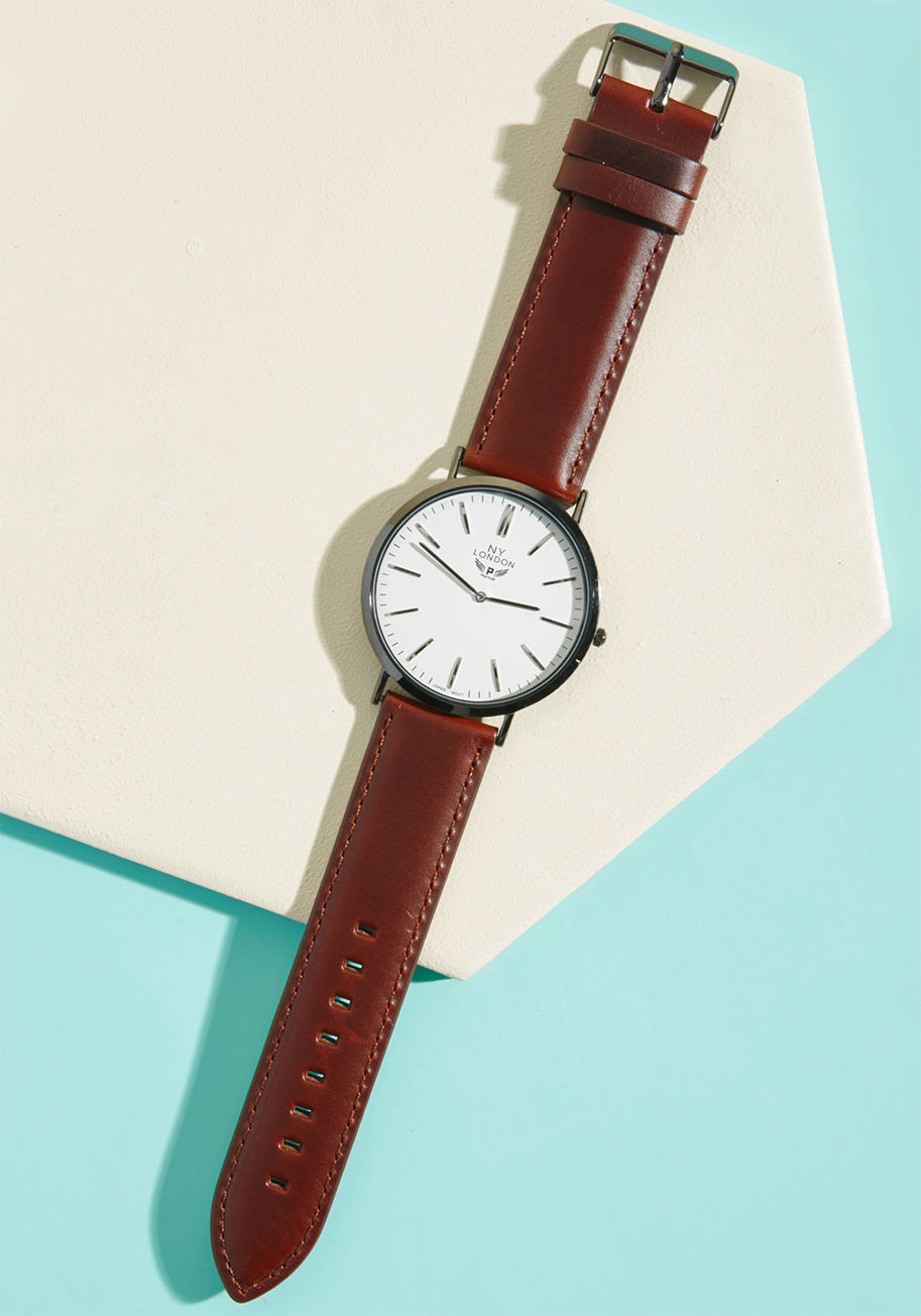 10015 - Whether your guy is perfectly punctual or habitually running behind, he's sure to appreciate this handsome watch. Supported by a mahogany-hued leather band and sparkling with a spectrum of silver hues, this classic timepiece will certainly look just as sw