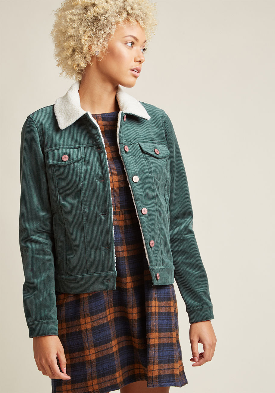 10180902 - A symphony of rustling leaves is your call to don this corduroy jacket! A faux-shearling collar provides contrast to this classic layer's deep green hue, while a quad of pockets accompany its brassy buttons. There's no better invite to show off this cool-