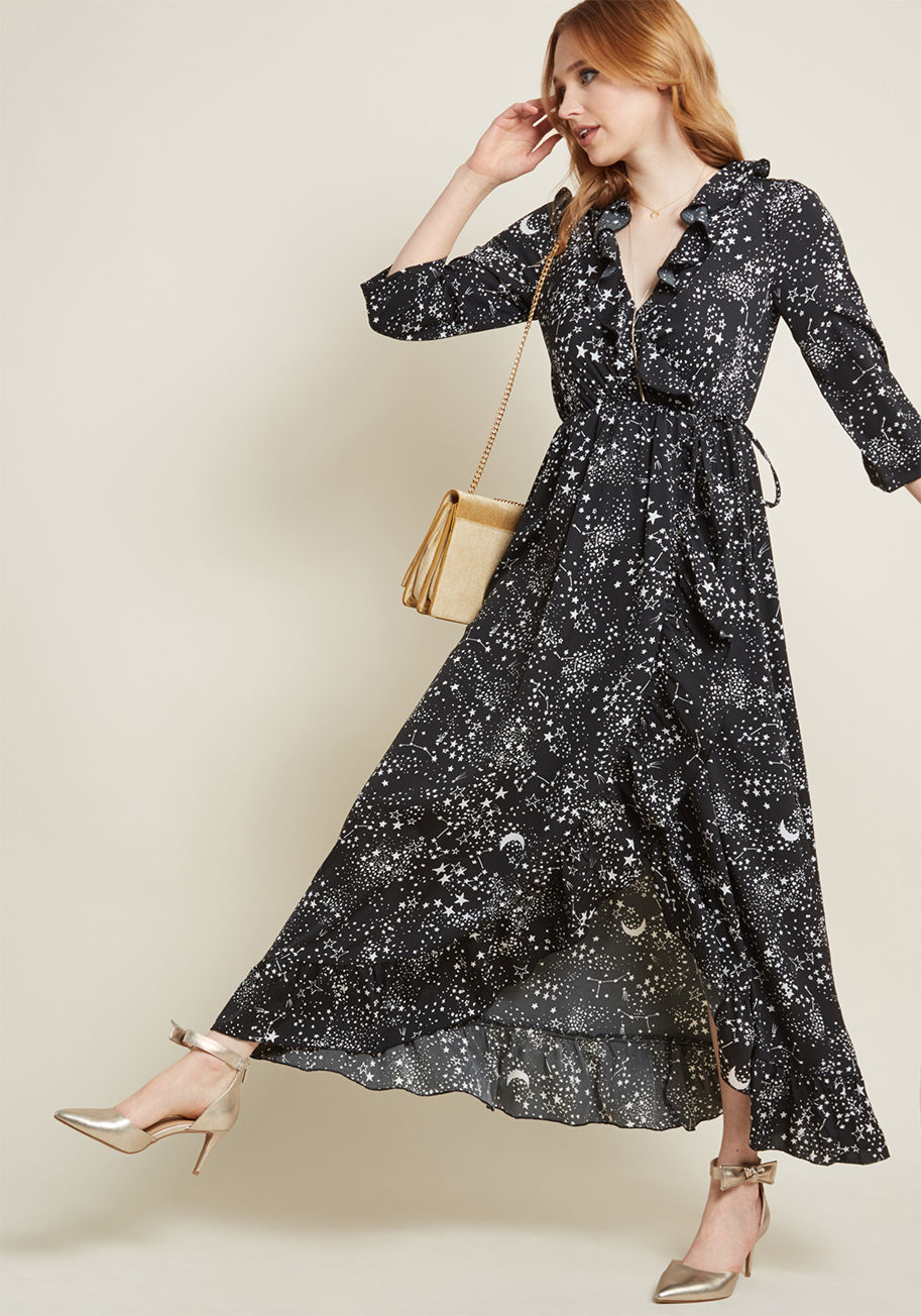 10200239 - What's the bigger meaning behind this black maxi dress' dazzling star pattern? It's that you're destined for pure panache! This 3/4-sleeved frock features a woven, wrap-inspired silhouette, trimmed with brilliant ruffles, affixed with a decorative side ti