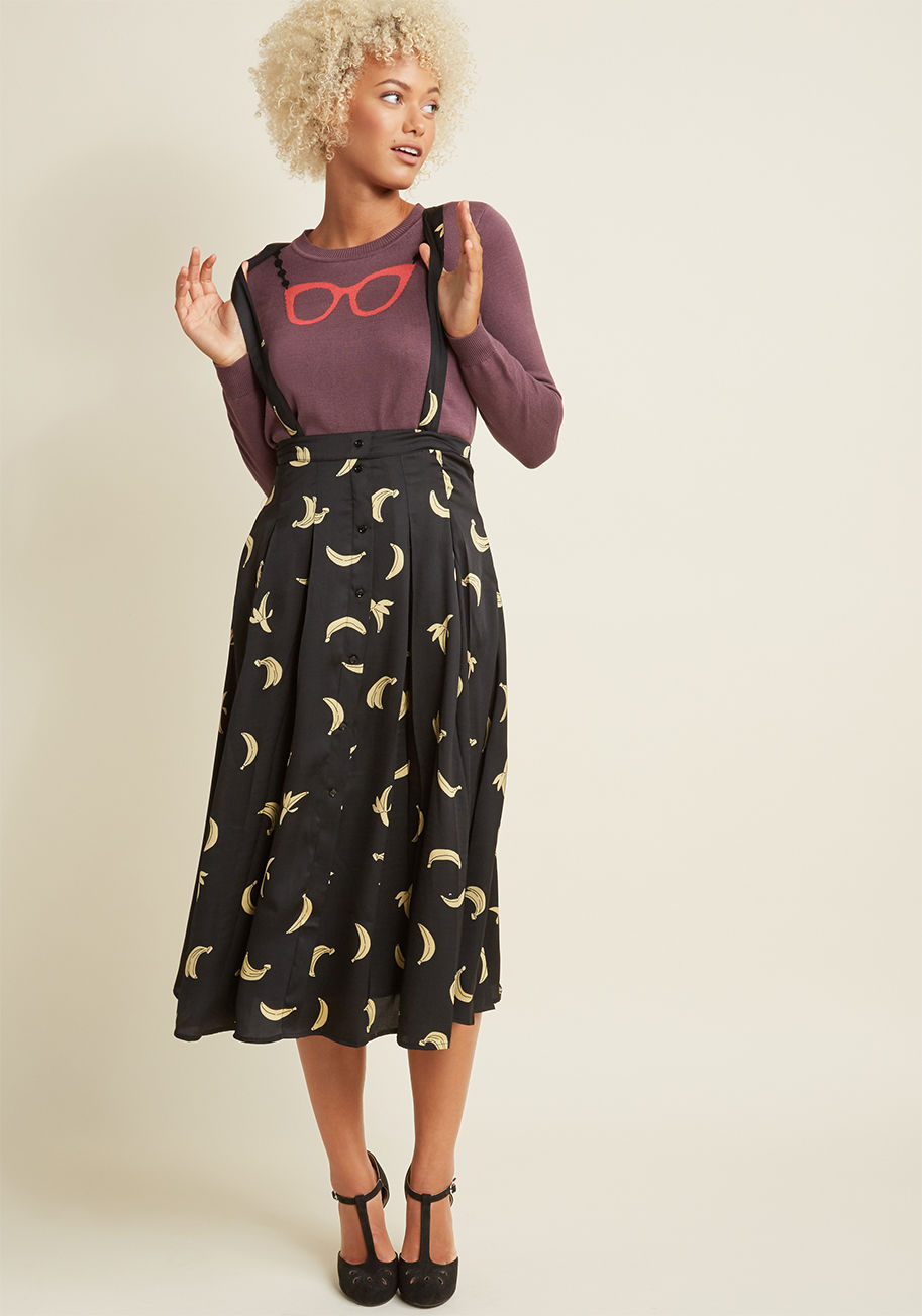 10561k7ff - Can't believe this black midi skirt is printed with playful yellow bananas? Well, we've got news for you! In addition to its potassium-rich pattern, this silky A-line offers up sleek pleats, hidden pockets, a button-up front, and optional suspenders, maki