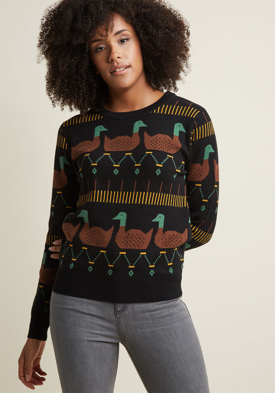 108649 - If you have your heart set on a critter-patterned pullover this year, then this black sweater from Pepaloves is a must-have. This super-soft separate features a brown, goldenrod, and green design emboldened by two rows of intarsia ducks. What's better, yo