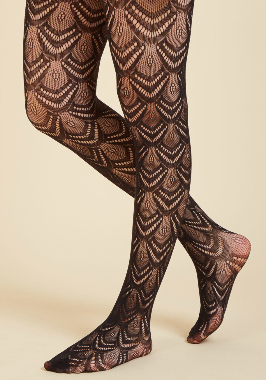 1127 - Stir up an already stylish situation by tossing these sheer black tights