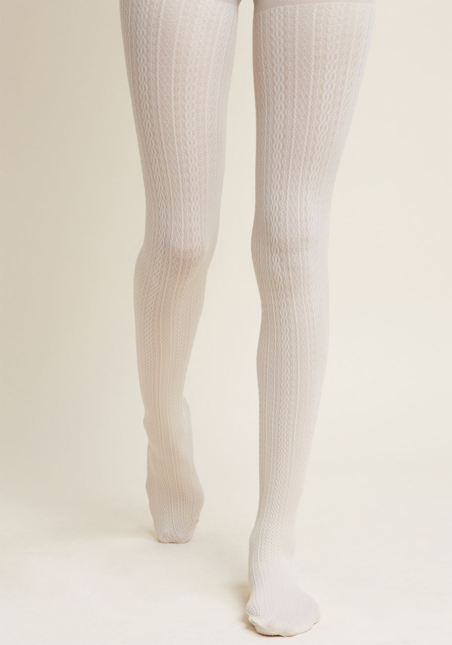 1182 - Delay praising these cream tights? Surely you jest! From the moment you don the cable-knit texturing of this chic hosiery, commendation for your style choice will echo throughout the rafters, and you can bet we&rsquo;ll have joined right