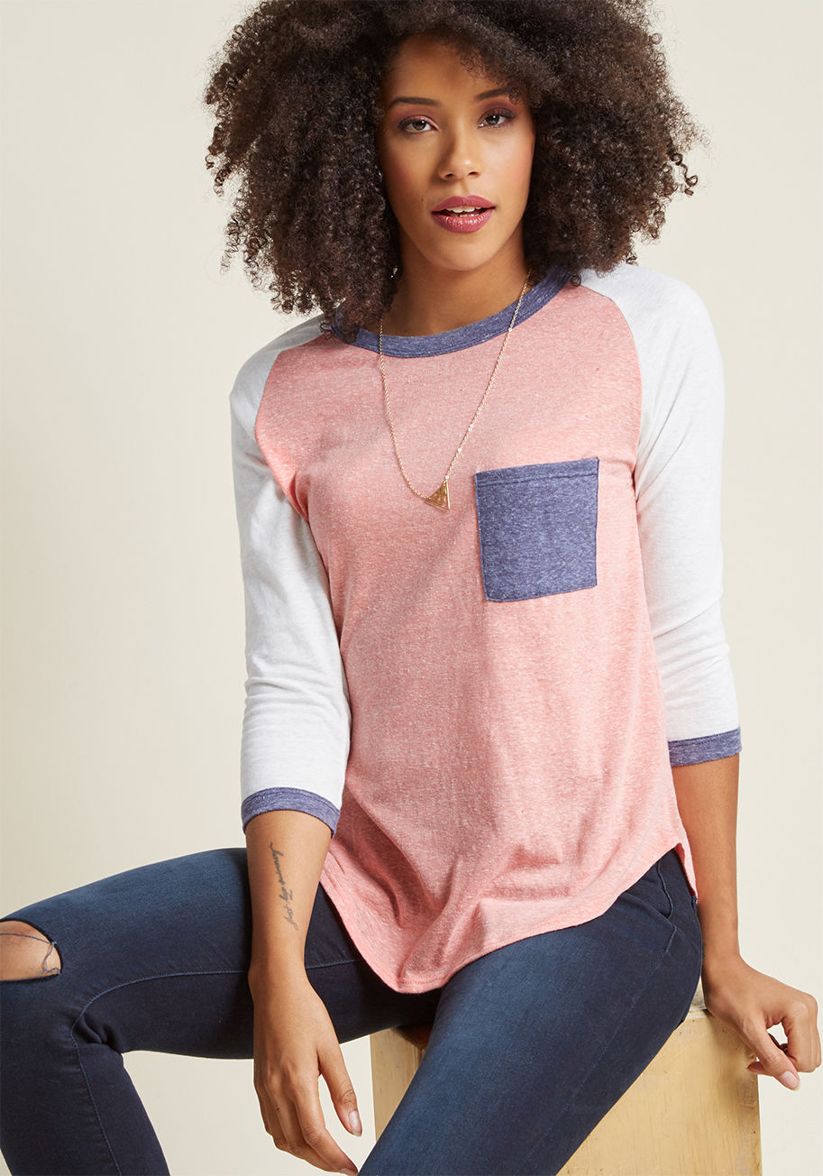 1259GO1 - If life's busy tendencies have you feeling a bit off-track, this raglan tee will turn things right around. The moment its heathered knit hits your frame, you'll feel a bit more at ease - not to mention the coral, white, and navy colorblocks of this pocket