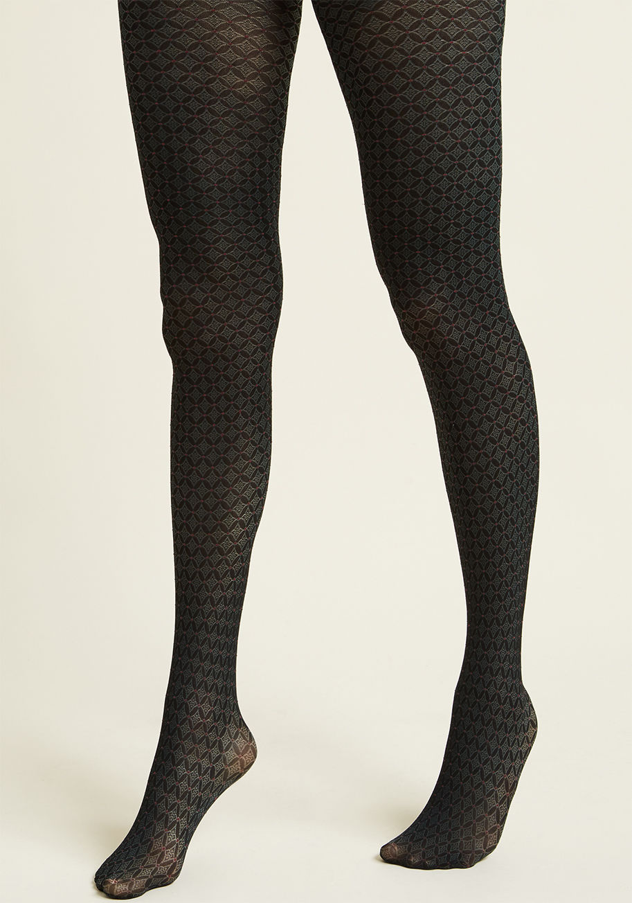 1373 - Boldness need not be reserved for key ensemble pieces like jackets and skirts - these black tights show that legwear can certainly shake things up, too! Ornate green diamonds framed by delicate red dots elevate this pair from simple wardrobe staple to sho