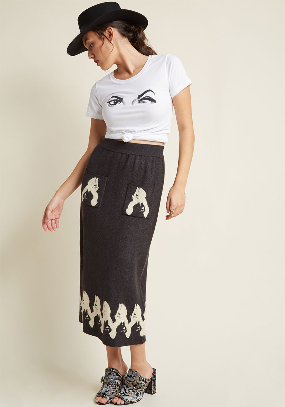 17-AW-KNT-09 - If classic silhouettes with unexpected touches are right up your alley, you're going to adore this grey sweater skirt from Miss Patina! Crafted from ultra-warm knit fabric and enhanced with ivory kitty silhouettes atop its patch pockets and back-vented he