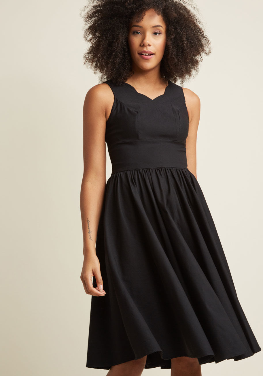 17429 - It's a beautiful experience when looking and feeling your best intersect, so discover that rush once more with this black midi dress! Taking the classic LBD style and elevating it with a playfully-scalloped neckline and banded waist with gentle gathering 