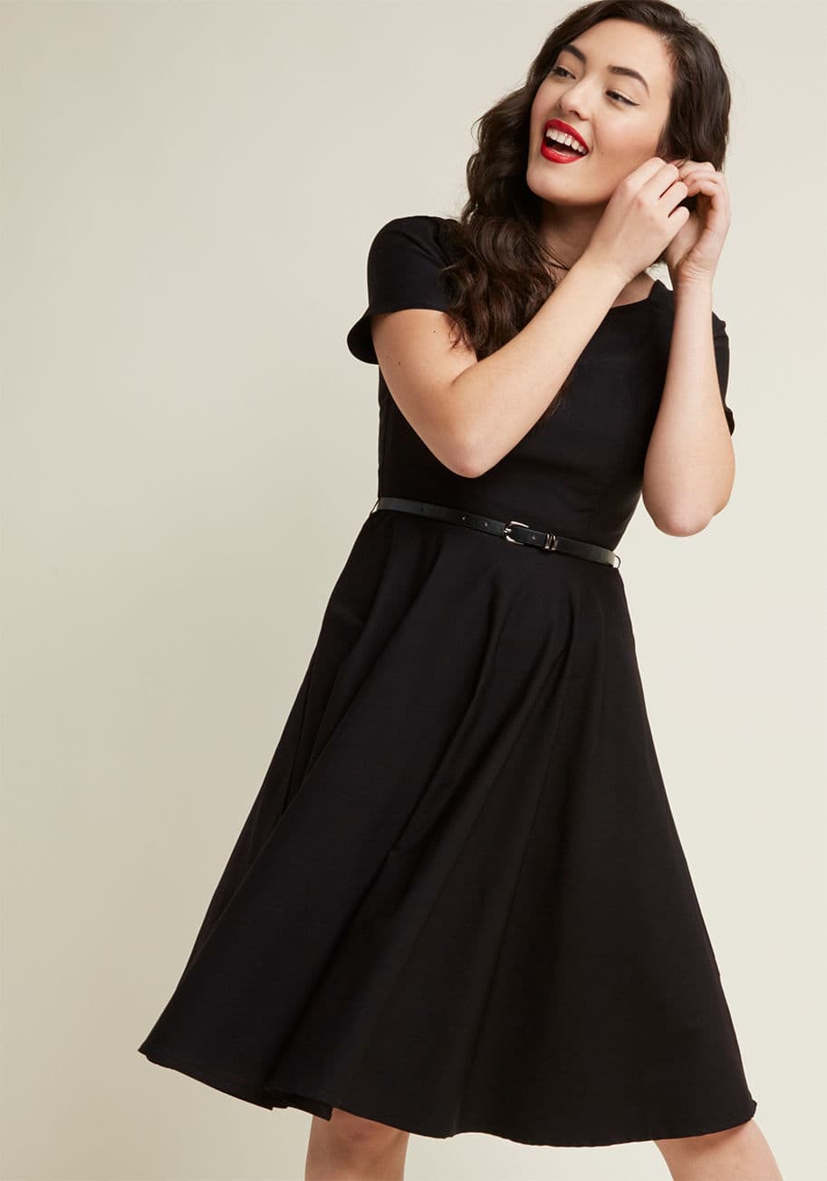 17445 - Between bouts of adventurous outfitting, you'll always return to this dashing black midi dress to ground yourself