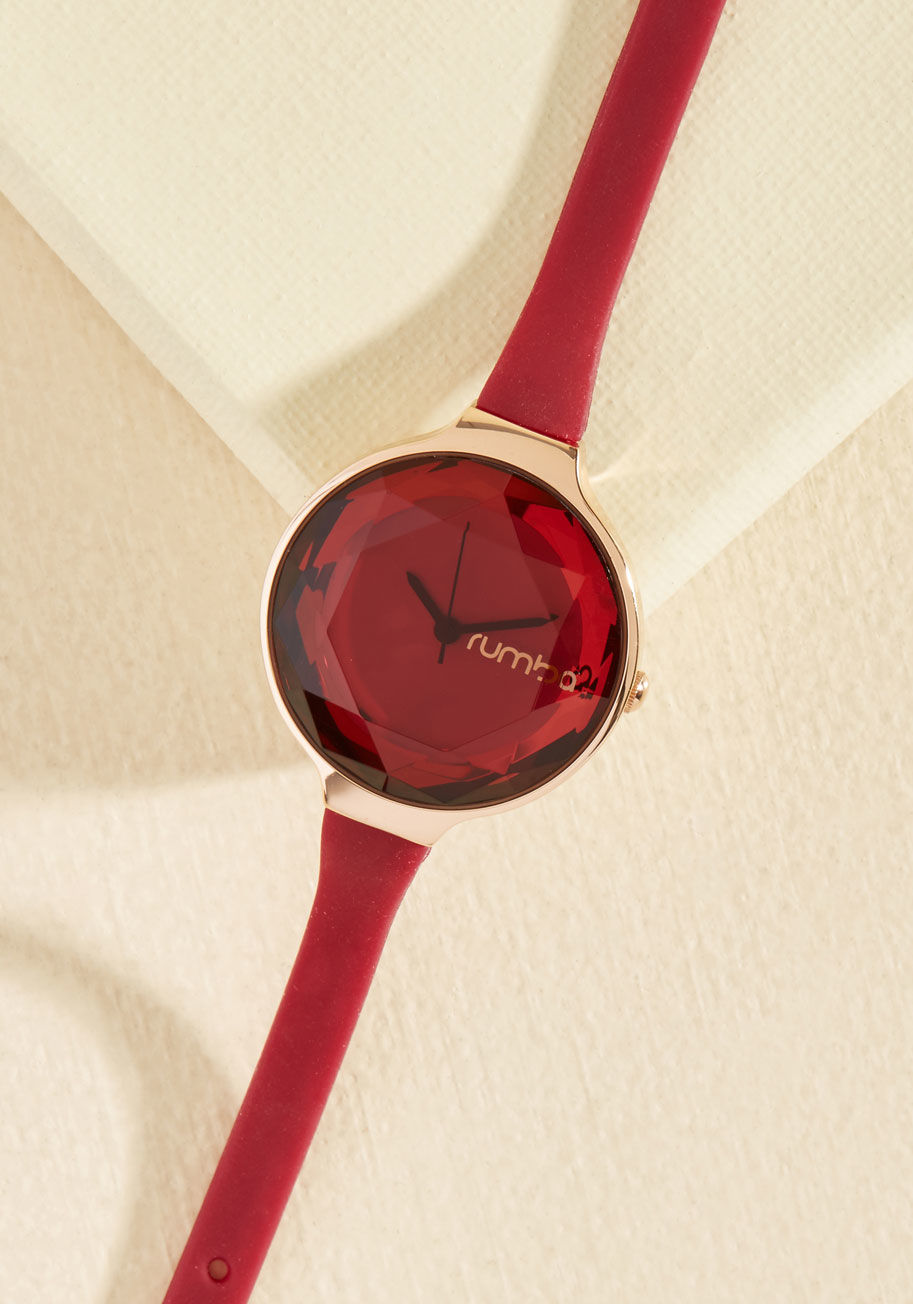 22711 - Every aspect of an ensemble is of utmost importance. Attend to the particulars of your outfit by wearing this rich red watch as the finishing touch. A slim strap affixes this gold piece by RumbaTime to your wrist, while a delicate, fashionably faceted fac