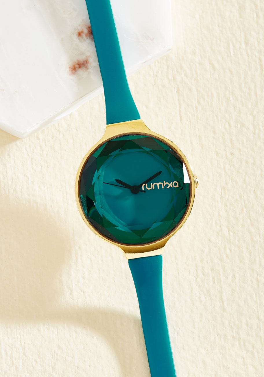 22735 - Every aspect of an ensemble is of utmost importance. Attend to the particulars of your outfit by wearing this indigo watch as the finishing touch. A slim strap affixes this gold piece by RumbaTime to your wrist, while a delicate, fashionably faceted face 