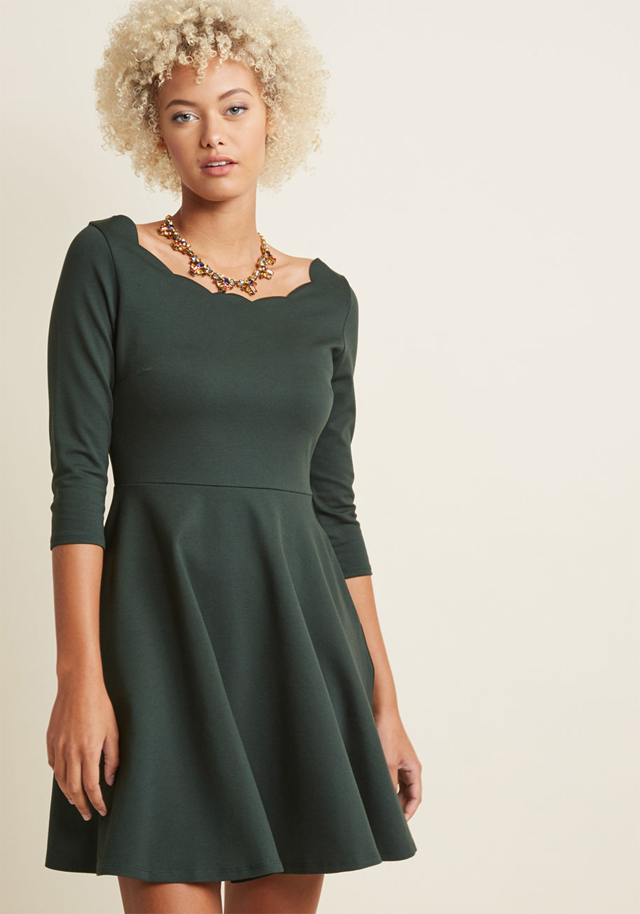 31521M-0022 - What goes well with malts, lindy hops, and retro rock? This vintage-inspired dress, of course! A stylishly scalloped neckline combines with 3/4-length sleeves and a fit and flare skirt to make this pocketed piece absolutely perfect for a night of swinging