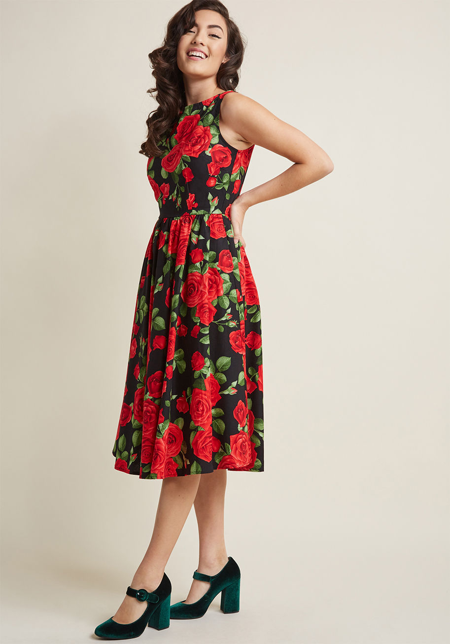 3435 - There's fine feeling attributed to finding a look that's a true keeper - discover the rush with this black midi dress! A ModCloth-exclusive print of red roses brings new life to the A-line silhouette of this pocketed number from Retrolicious, and what's m