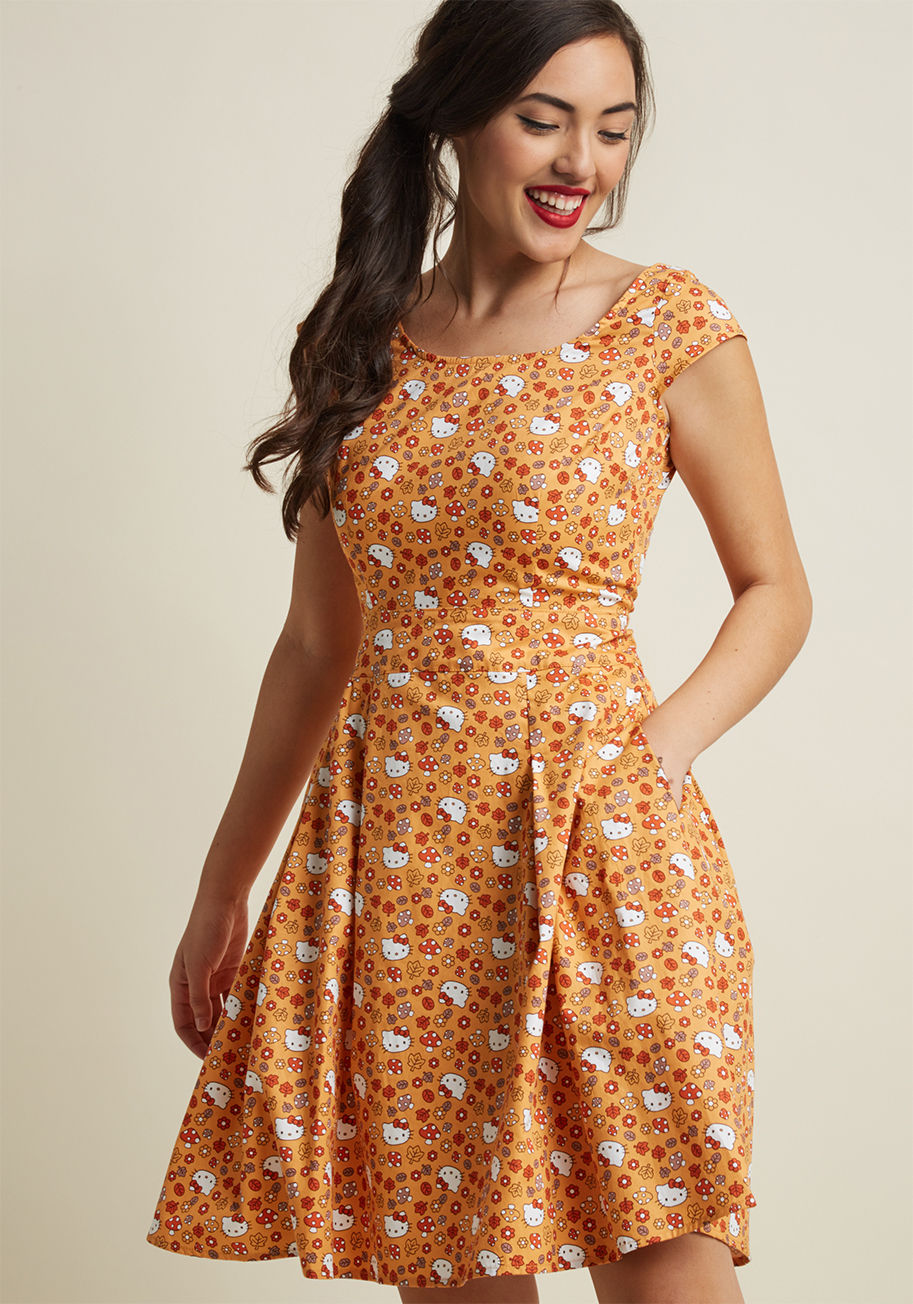 3508 - There's just something about a cotton dress with a bold print that draws you in. This orange, LA-made number from Retrolicious amplifies the allure of its cap sleeves, bateau neckline, hidden pockets, and pleated skirt with a ModCloth-exclusive pattern of