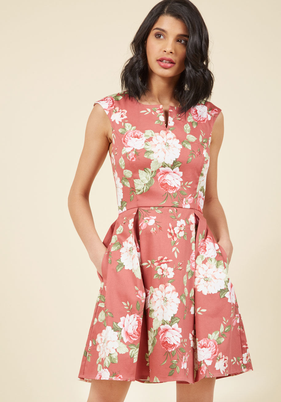 3980 - We can't think of a better accessory for this mauve dress than your uplifting attitude! Pair up the cap sleeves, notched neckline, and pocketed skirt of this fun, floral number - a ModCloth exclusive - with your award-winning smile and sprightly sashay fo