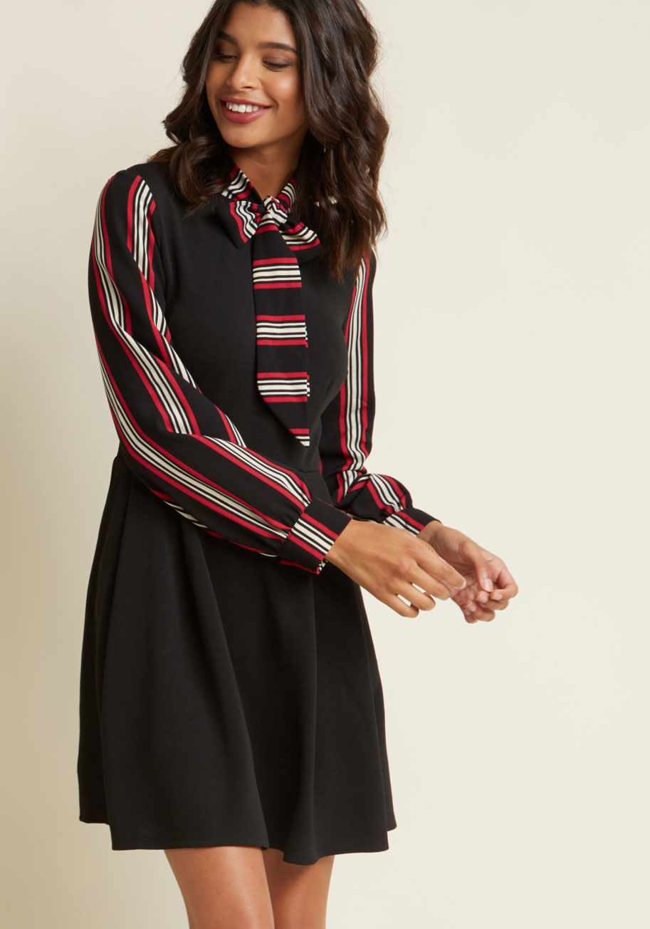 4315M-0010 - Your sassy debut of this black dress will provide all the confirmation you need to rock it on the reg! From close colleagues to passersby, everyone will find themselves abuzz over this knit frock's tied neckline, long sleeves, and red-and-ivory, striped c