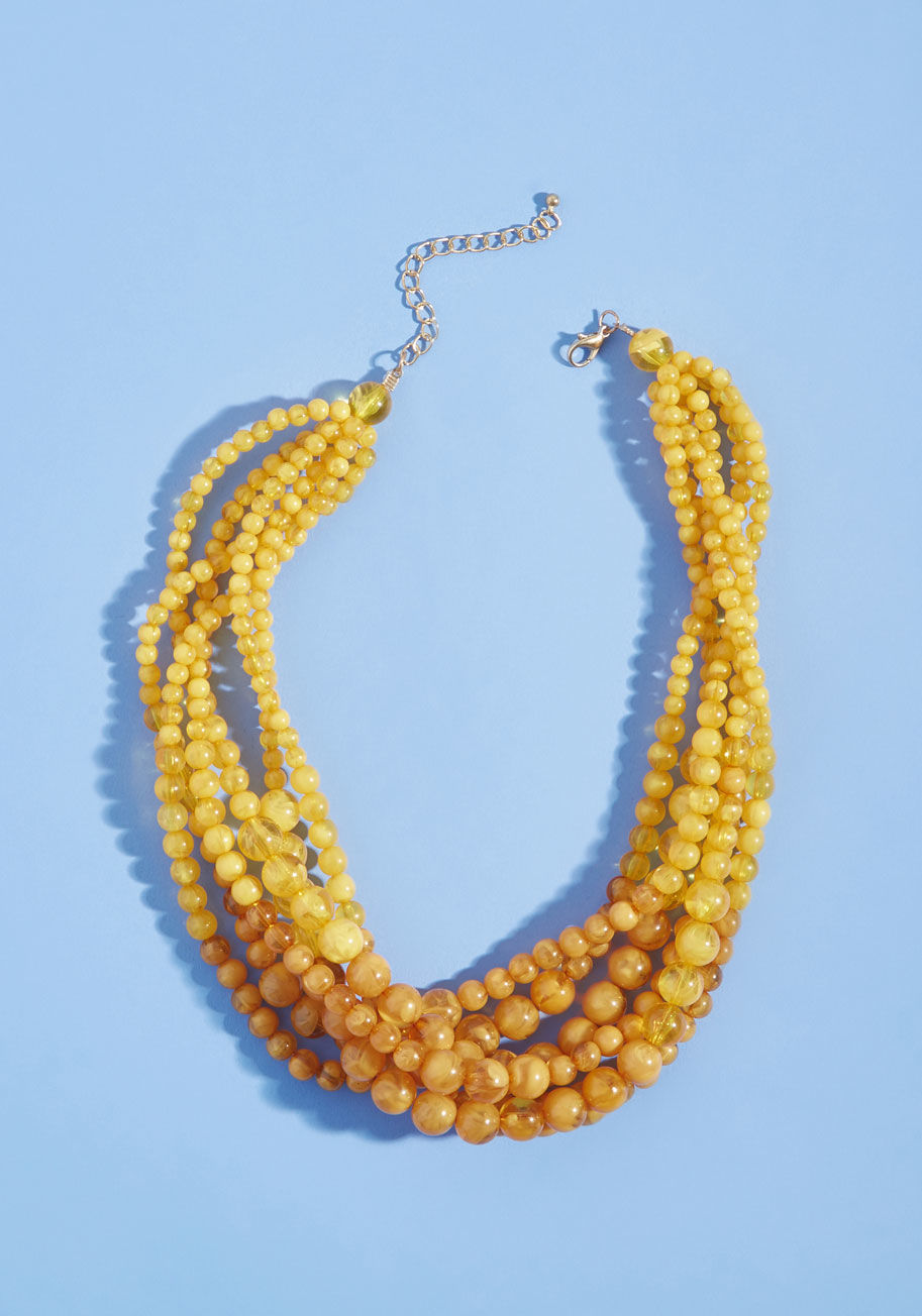 441589N-009 - This beaded necklace is the tops! Want us to prove it? Easy - we suggest styling its twisted layers of mustard-and-amber yellow strands with a statement-making outfit. As soon as you do, you'll see it too!