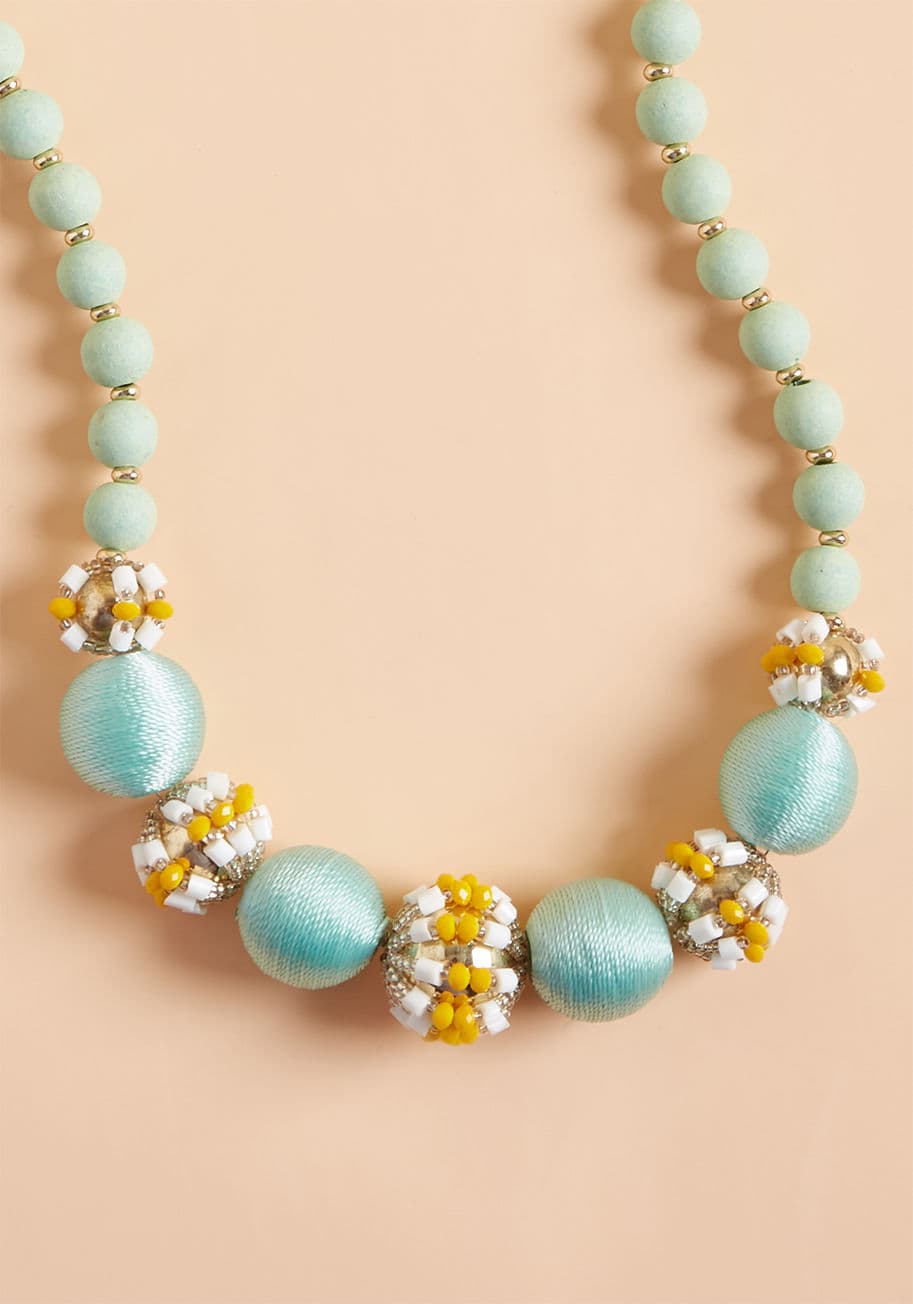 454229N-002 - According to your style rules, if it shines, you simply must have it - and this mint necklace is no exception! Thread-wrapped spheres with a subtle sheen cozy up beside bulbs of goldenrod and white beads, creating an accessory so indulgent, it's no wonder