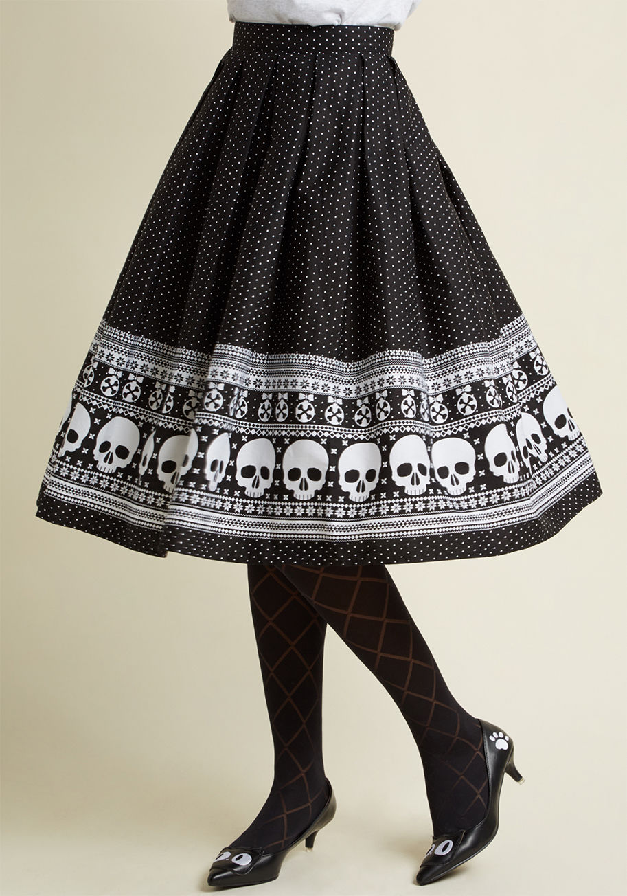 5398 - Upgrade your red-and-green garb for this black circle skirt! Made unconventionally cheerful with a print of crossbone ornaments, a trim Fair Isle skulls, and pair of pockets for storing little gifts for loved ones, this pleated midi puts your edgy seasona