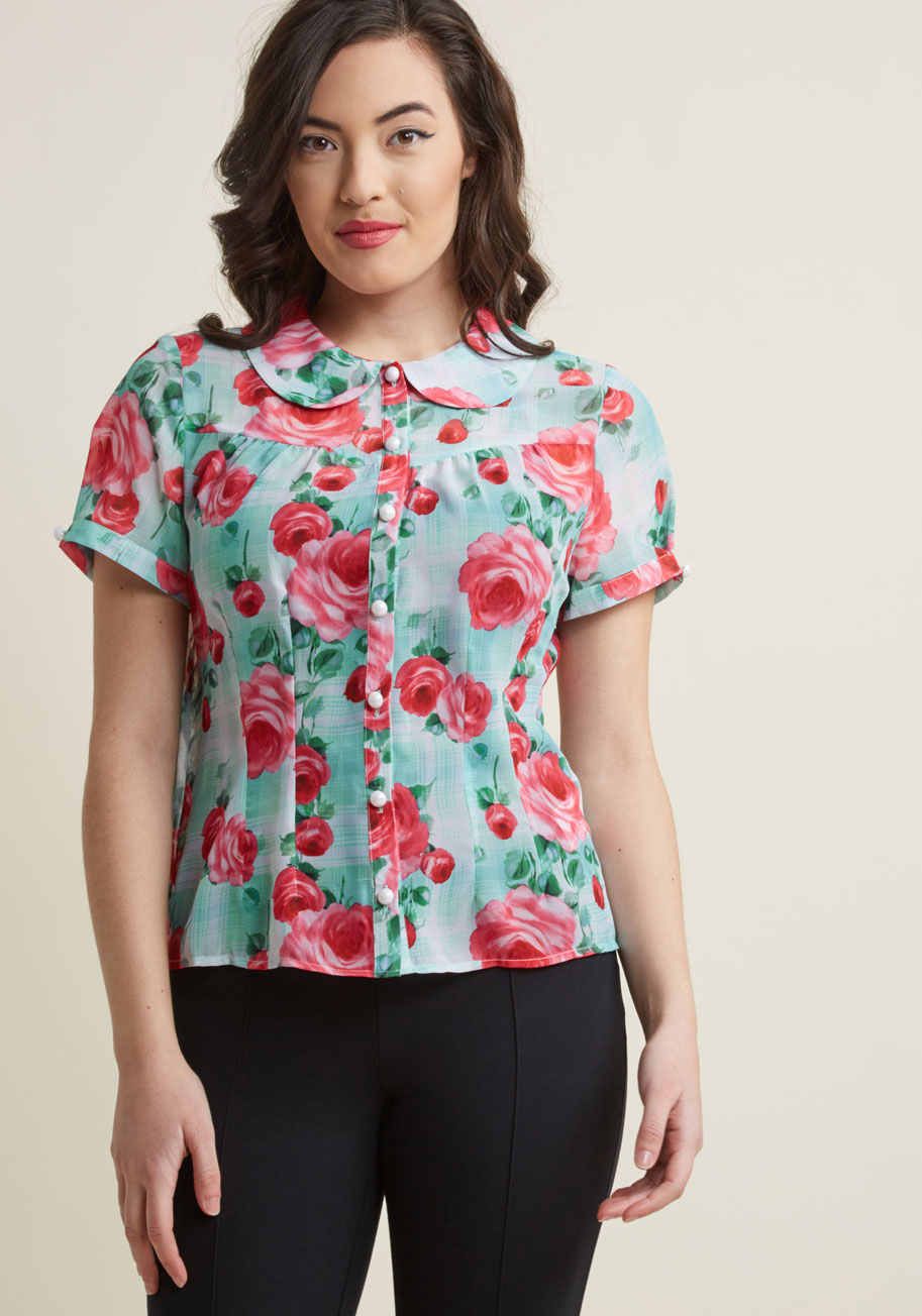 6625 - Building today's ensemble has you questioning - go retro or modern? Upon spying this mint green blouse by Hell Bunny, you decide vintage-inspired is the optimal choice! With its Peter Pan collar, pearly white buttons, and pink floral print, this chiffon t