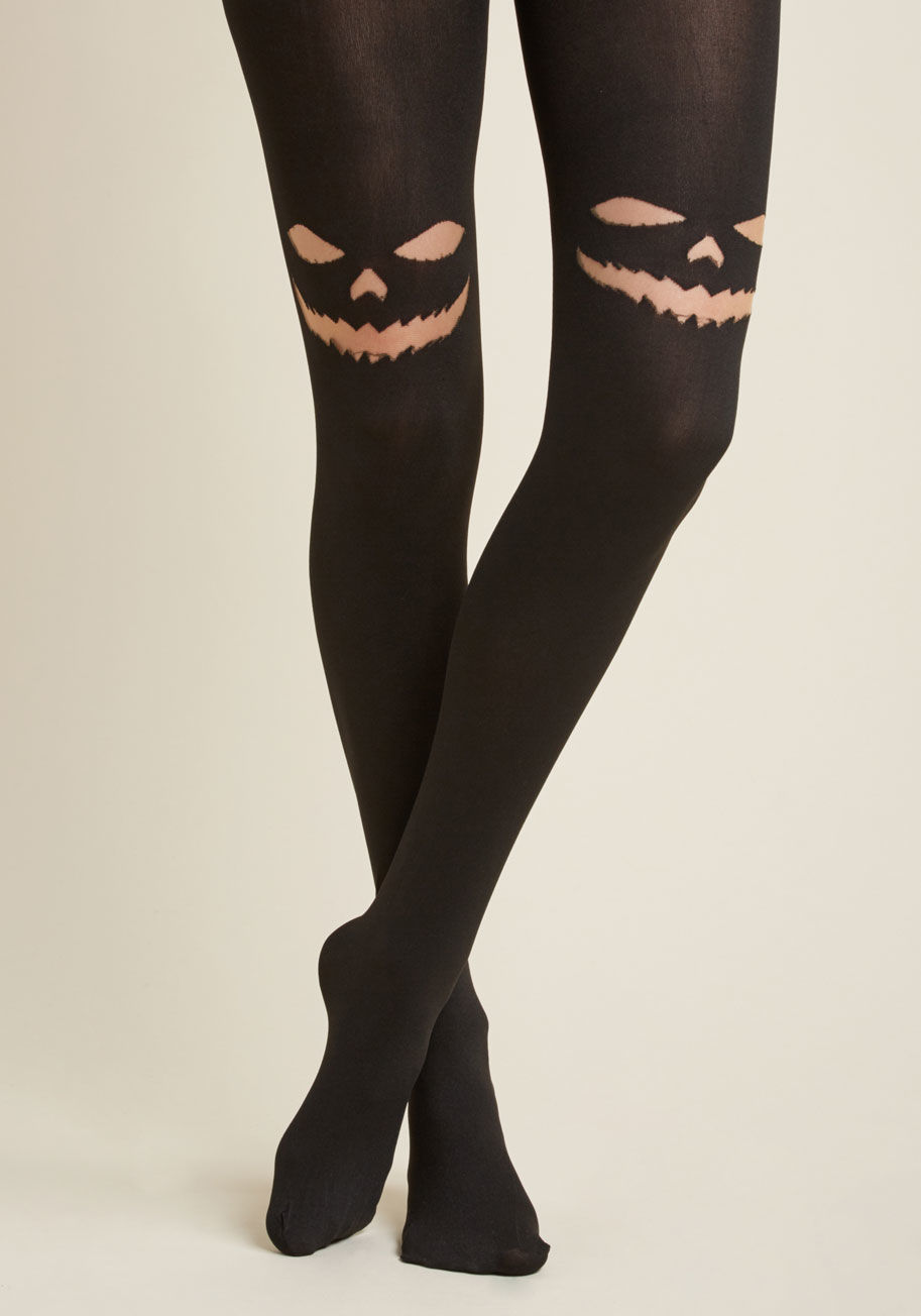 7740 - Hurry up and flaunt these opaque black tights before the other witches get word! Carved out with a sheer jack-o-lantern face at each knee, this creepy-chic legwear is one sure way to a 'boo-tiful' ensemble.