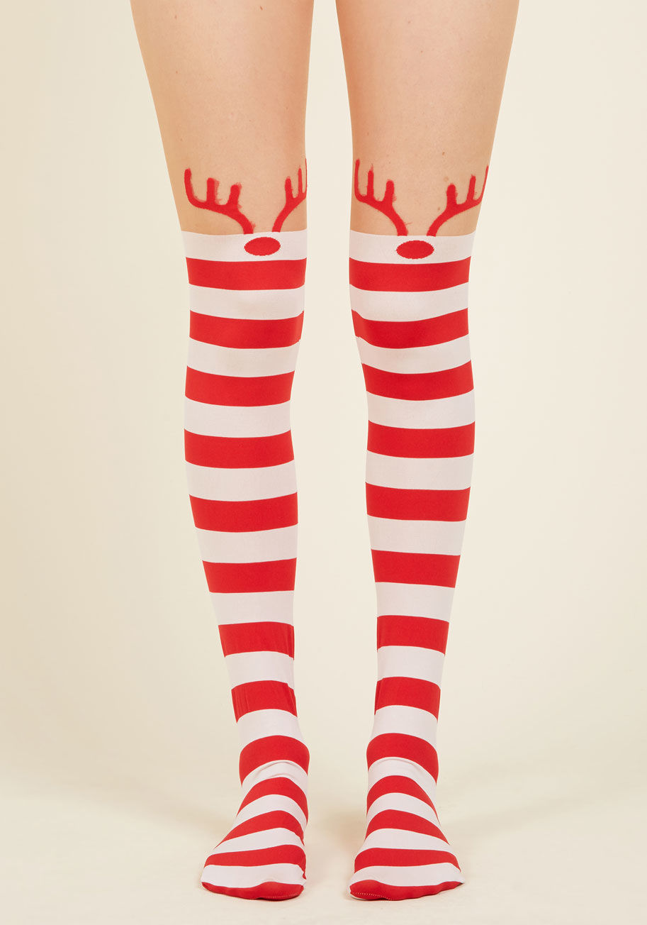 7945 - Anyone who rises to the roof wondering what the clatter's all about will be answered with the antlers of these quirky tights! Sheer beige uppers allow the red-and-white striped sections of these stockings to act as festive thigh highs, turning each of you