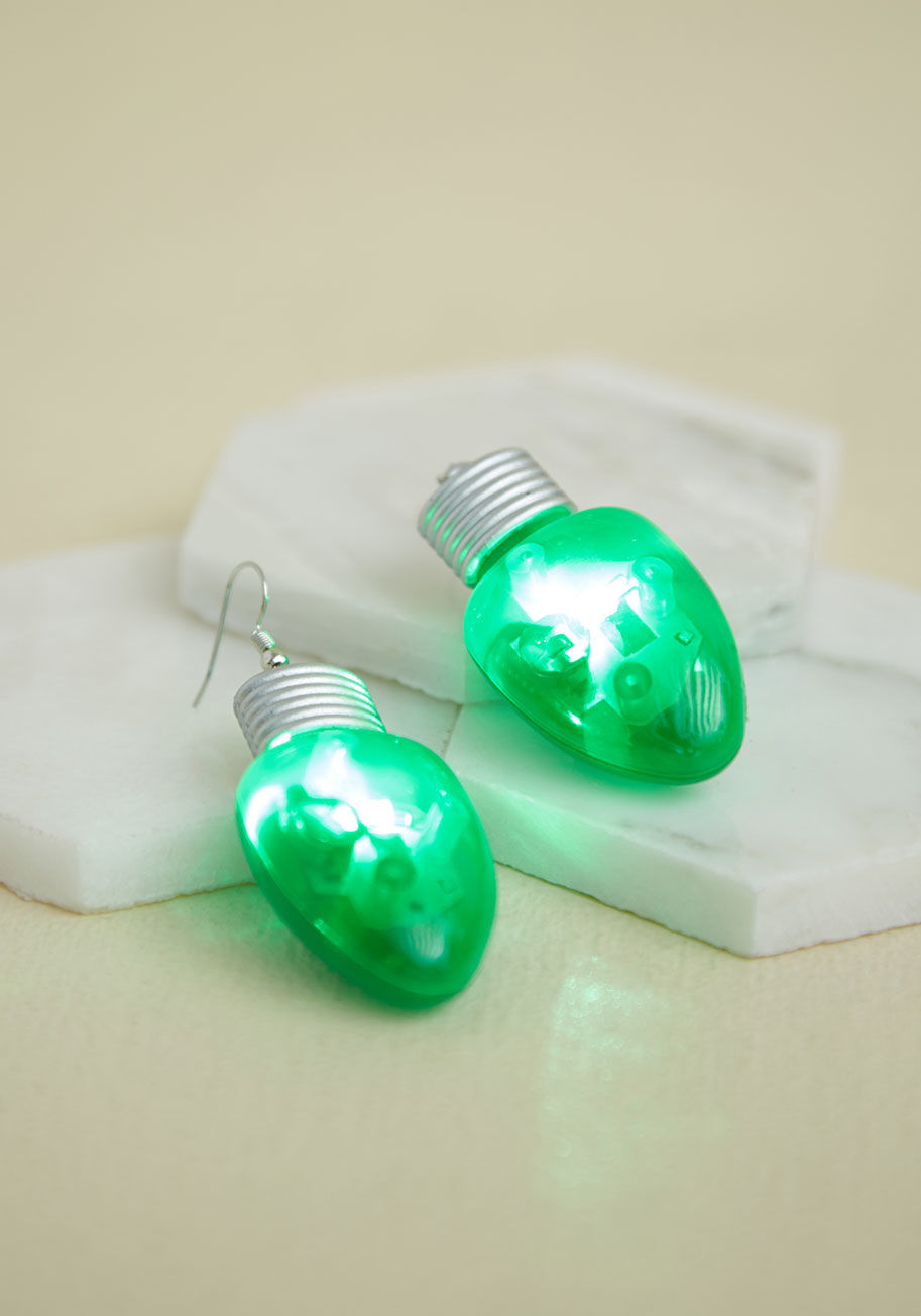 80955-GN - How holiday-happy can you get? These light-up earrings prove you're down to go all in! Delightfully green and silver, with a matching button behind each bulb to make them flash with LED fabulousness, this statement-making pair arranges for a jolly style e