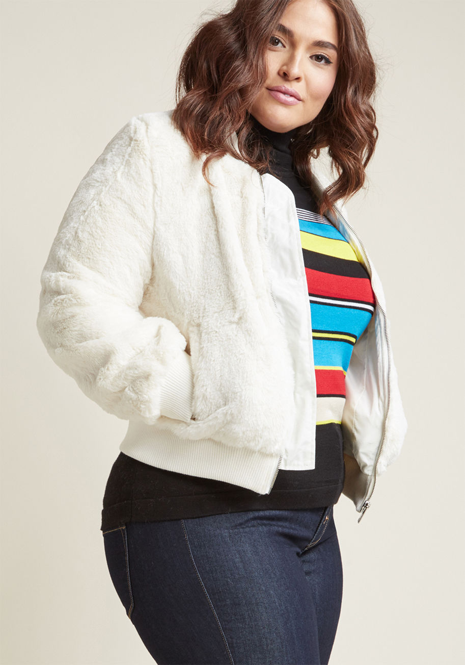 8194JS - It's like, one moment everything was fine, and then the next, you felt a profound pull toward this faux-fur bomber jacket! Daringly ivory and fastened with a silver zipper, this lined jacket is a serious statement. Plus, its ribbed knit neckline, sleeve c