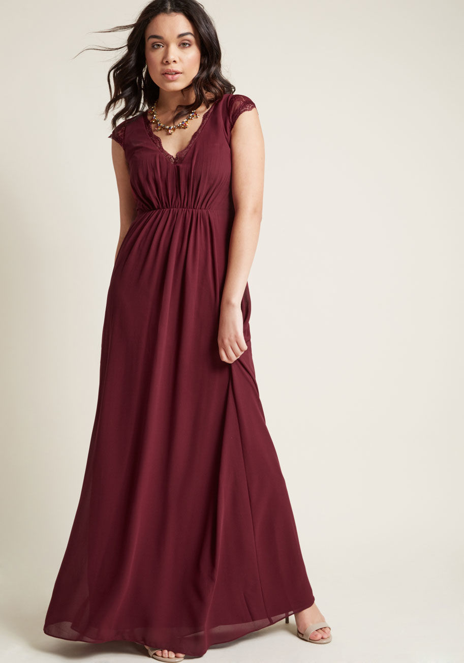 8421-1 - This burgundy maxi dress is fated to find you swooning! Don't be surprised if you become totally enamored with the lace cap sleeves, sheer back, gentle gathering, and chiffon overlay of this ModCloth-exclusive gown, for its padded bust cups and sweeping l