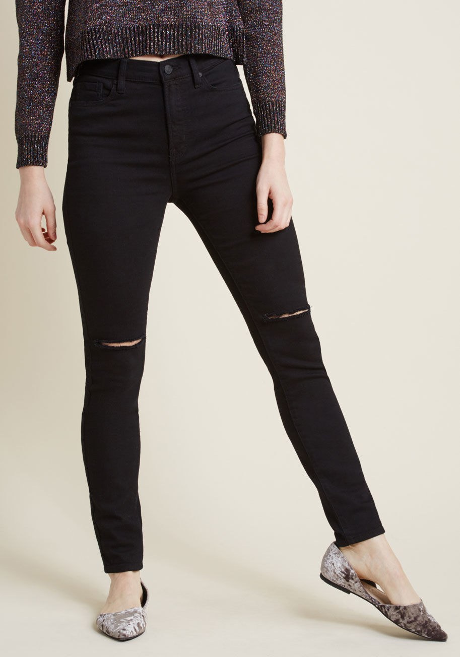 9158BLK - For those days when you're feeling bold and brilliant, slip into these black skinny jeans and show your stuff! Finessed with stretch, packed with pockets, and distressed atop each knee with subtle vents, this staple-worthy pair amplifies your personal edg