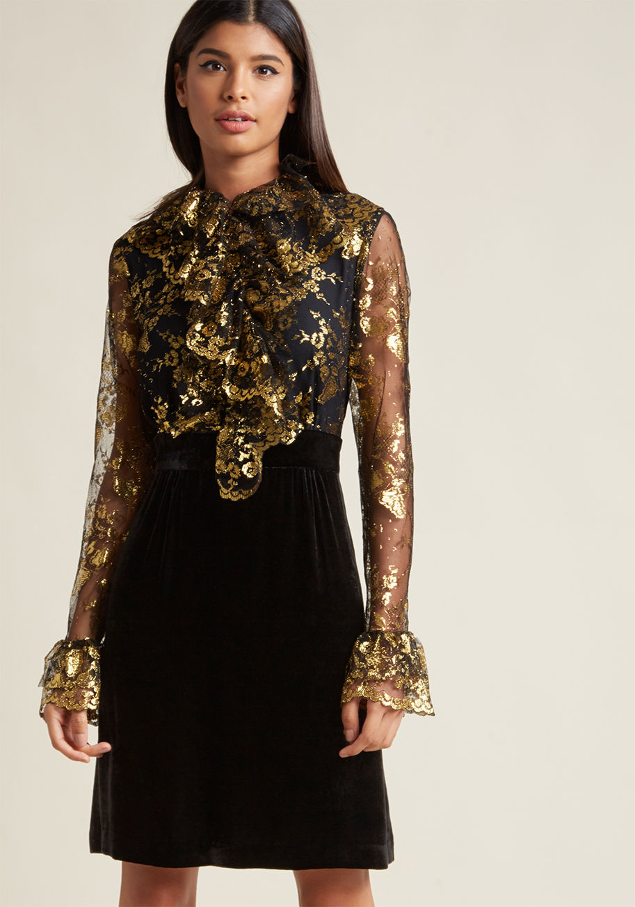 917R70 - Lead your sassy style squad with the confidence you exude from flaunting this black dress from Anna Sui. Metallic gold accents highlight this frock's floral lace, which is fashioned into ruffles at the placket and sheer sleeve cuffs. Finished with a velve