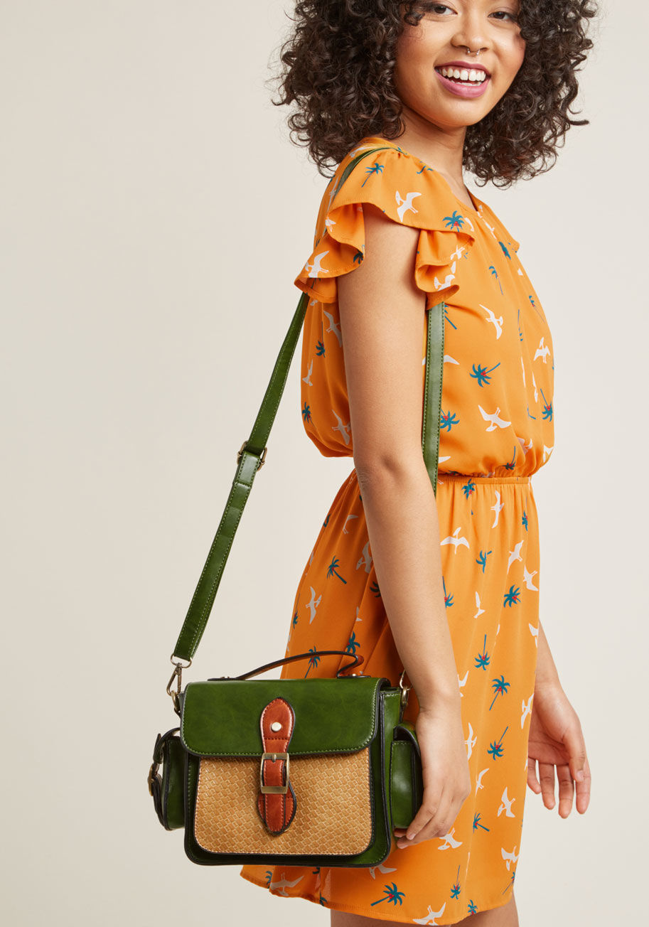 9693W - One minute you're at the co-op, the next, a rooftop bar downtown. While your schedule is full of spontaneity, one thing stays constant - your attachment to this faux-leather satchel! With its green and tan motif, abundant pockets, and basket-style texturi