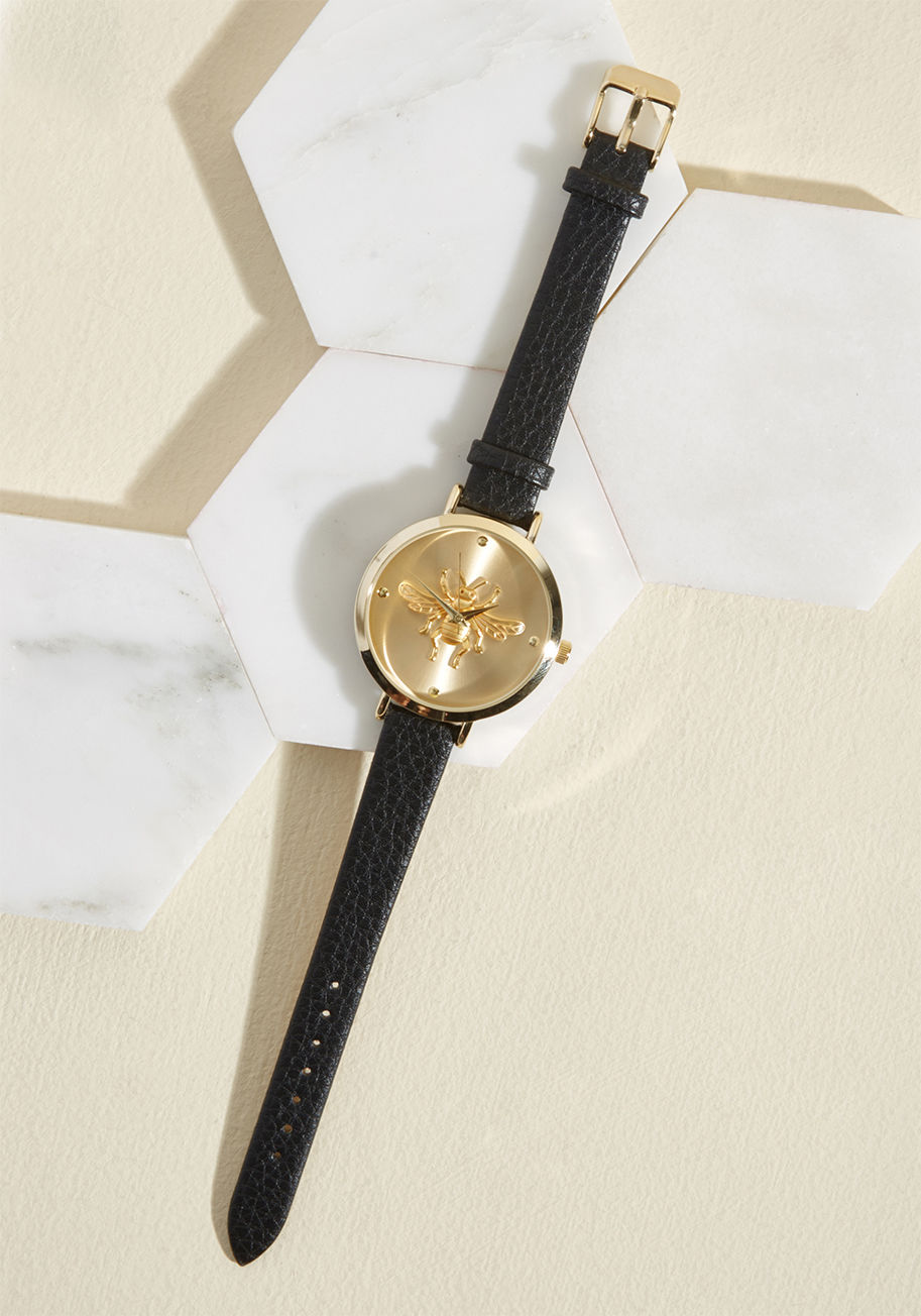 9859 - Our advice may only mean so much, but we swear this brushed gold watch was basically made for you! We love that its black, faux-leather straps are textured, that the rim of its large face is shined to perfection, and that its simple face displays a darlin