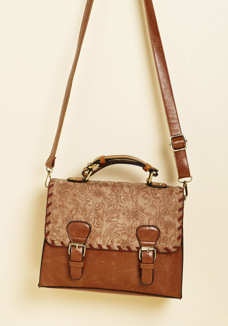 9992 - Our favorite way to see the classic satchel get all jazzed up? Through thoughtful embossing and bold topstitching, of course! This faux-leather crossbody boasts those details alongside gold hardware, a spacious interior, and a versatile caramel hue, makin