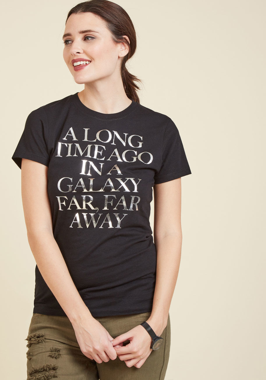 A8066KAF7 - Ensure your geek-chic fashion efforts are always noticed by sporting this black T-shirt! Boasting a metallic silver screen print that stylishly announces where you'd rather be, this bold cotton top deserves top honors for proclaiming your favorite fandom 