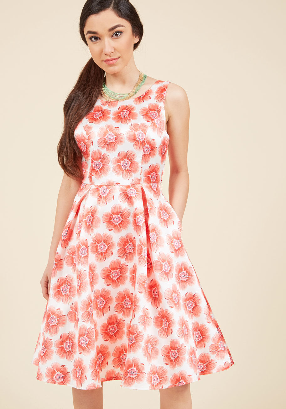 AFA566 - While you mingle hoping to see a special someone, onlookers are blown away by your ivory-and-pink floral dress! While its classic silhouette, sweet V-back, princess seams, and pockets are busy garnering a bounty of compliments, the satiny finish of this M