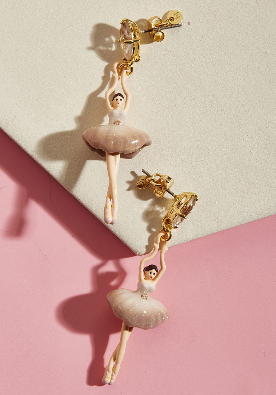 AGDD115T/2 - Position yourself as the most posh and cultured socialite on the scene by sporting these mauve ballerina earrings from French brand Les Nereides! Featuring a hand-carved glass rhinestone from which a hand-enamelled brass dancer dangles, this glittering du