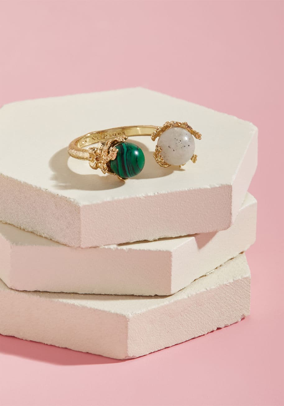 AGVE602 - Indulge your digits with this gorgeous ring, designed by none other than Les Nereides! Crafted lovingly from 14 carat gold-plated brass, this elegant adornment hosts a contrasting pair of glass pearls, cradled by delicate, coral-inspired frames. You deser