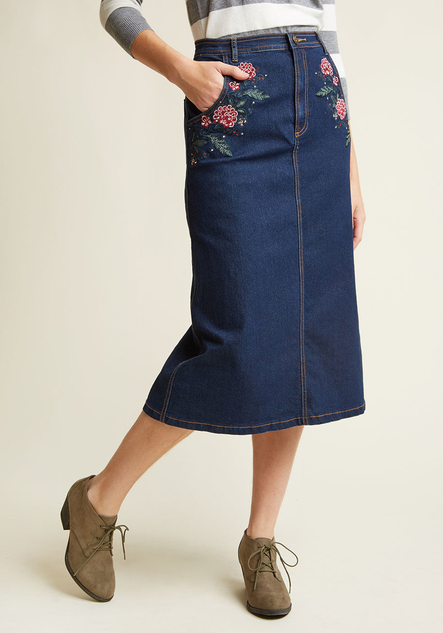 BBAW170311A - When your warm hello is accompanied by the winning style of this denim pencil skirt, your greeting will be all the more memorable! Touting goldenrod stitching and embroidered flowers blossoming around the front pockets, this stretch-boasting midi makes da