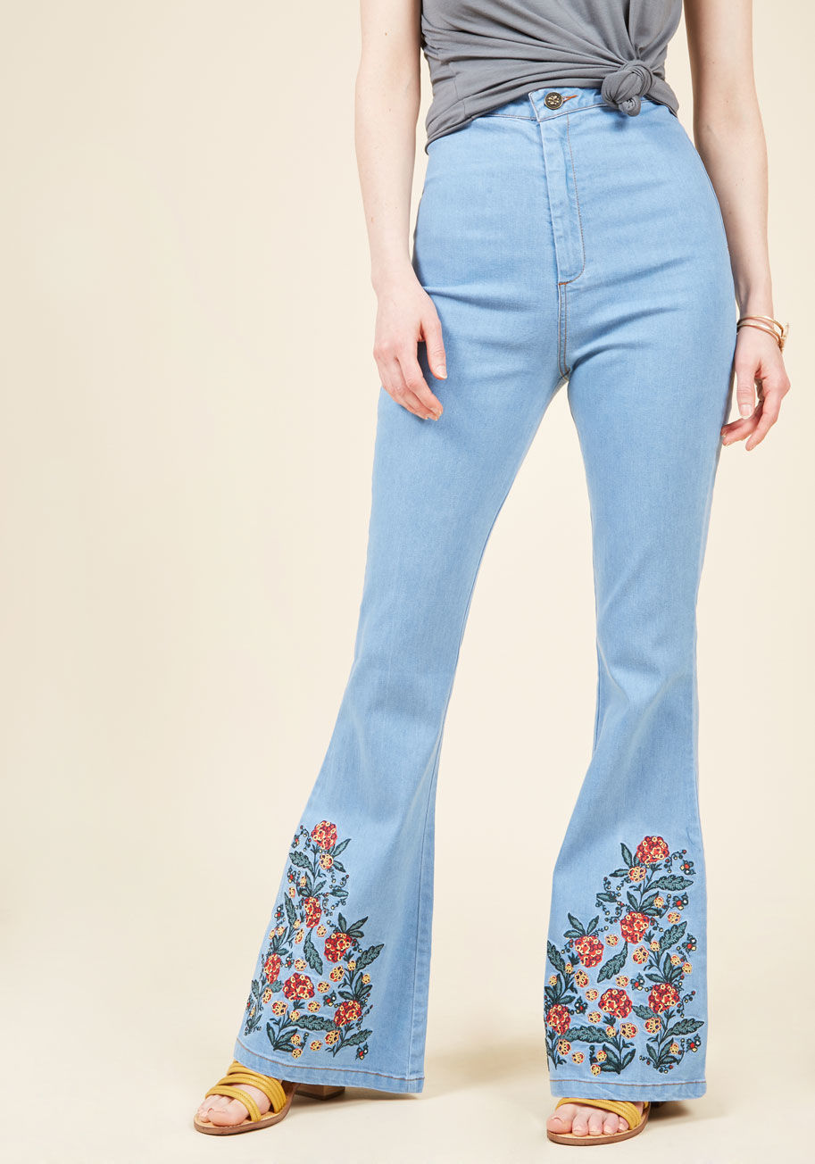 BBSS170202B - As far as you're concerned, these high-waisted jeans by Collectif could be very well be the best pair of bottoms you've ever owned! Take their light wash, back pockets, and boldly floral-embroidered bell bottoms for a spin and pay attention to how you fee