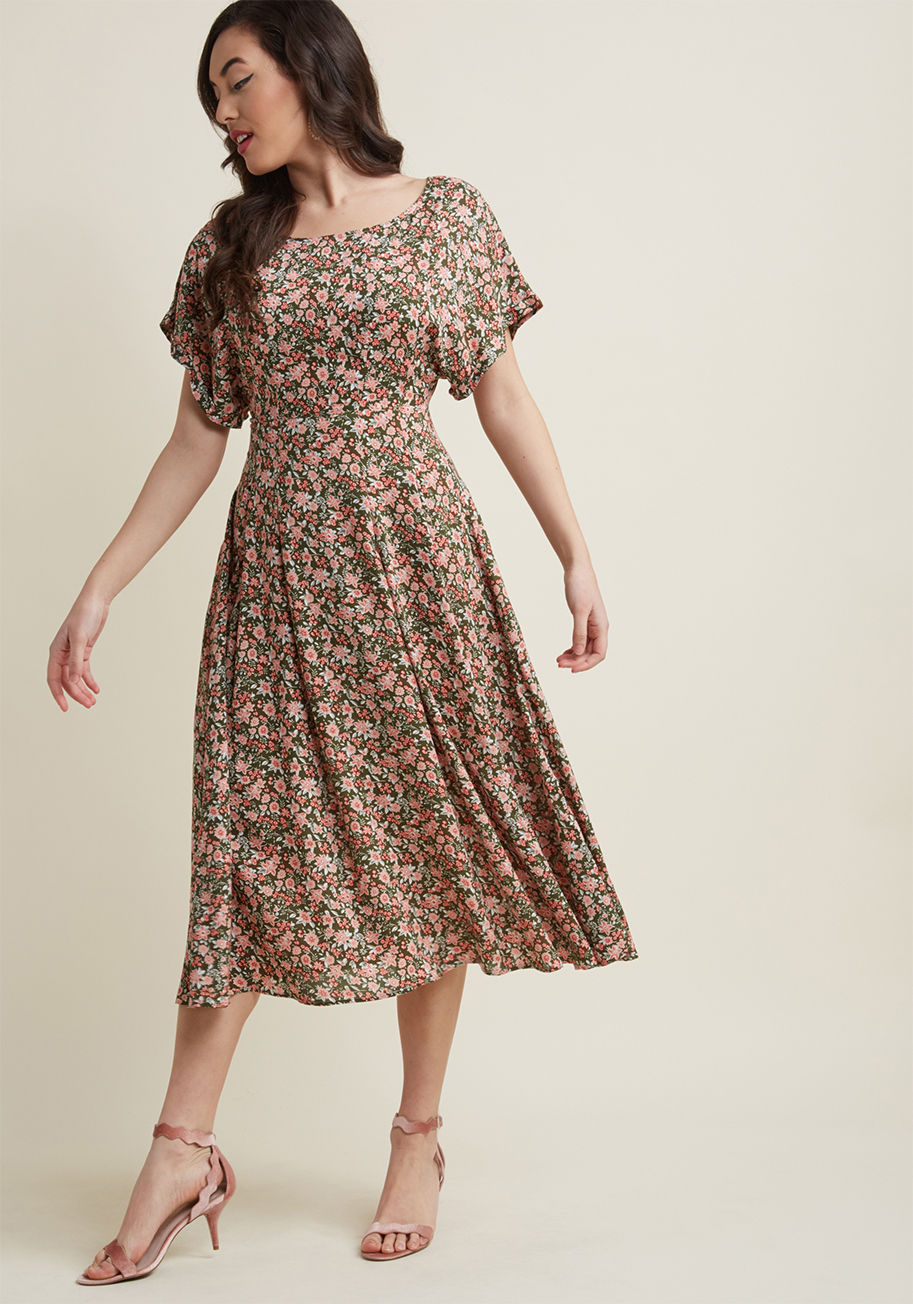 BBSS180801A - If the feminine pattern of this brilliant midi dress inspires anything, it's optimism and allure! Designed with lush pink flowers atop an olive green base hue, a kimono-inspired bodice featuring cuffed short sleeves, and an accent-pleated skirt, this eye-