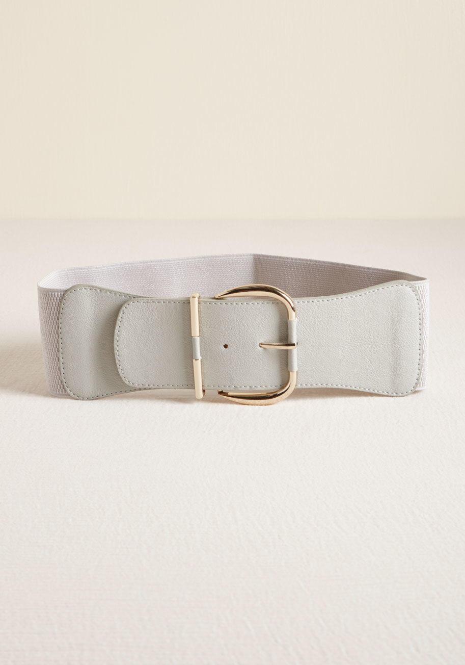 BE50781- Grey - How you accessorize says a lot about you, which means this grey belt speaks volumes of your outfit-finishing prowess! Faux leather at the front, elasticized around the back, and topped with a gleaming gold buckle, this figure-highlighting adornment expert