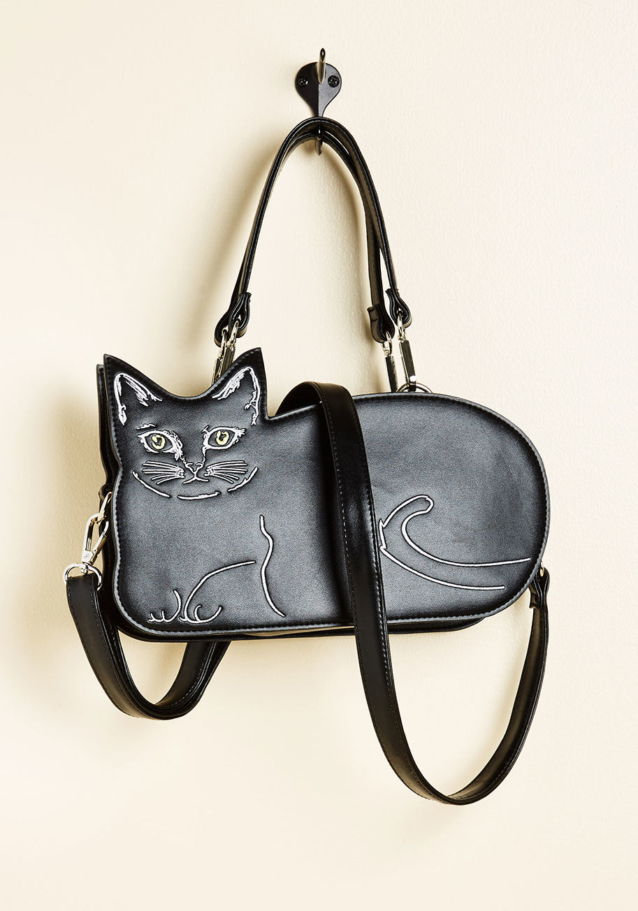 BG7135-SP - Don't expect the excitement you experience for flaunting this black cat purse to run out anytime soon! Faux leather and fabulous, this quirky Banned bag comes equipped with a removable crossbody strap, white embroidery to highlight its feline silhouette a