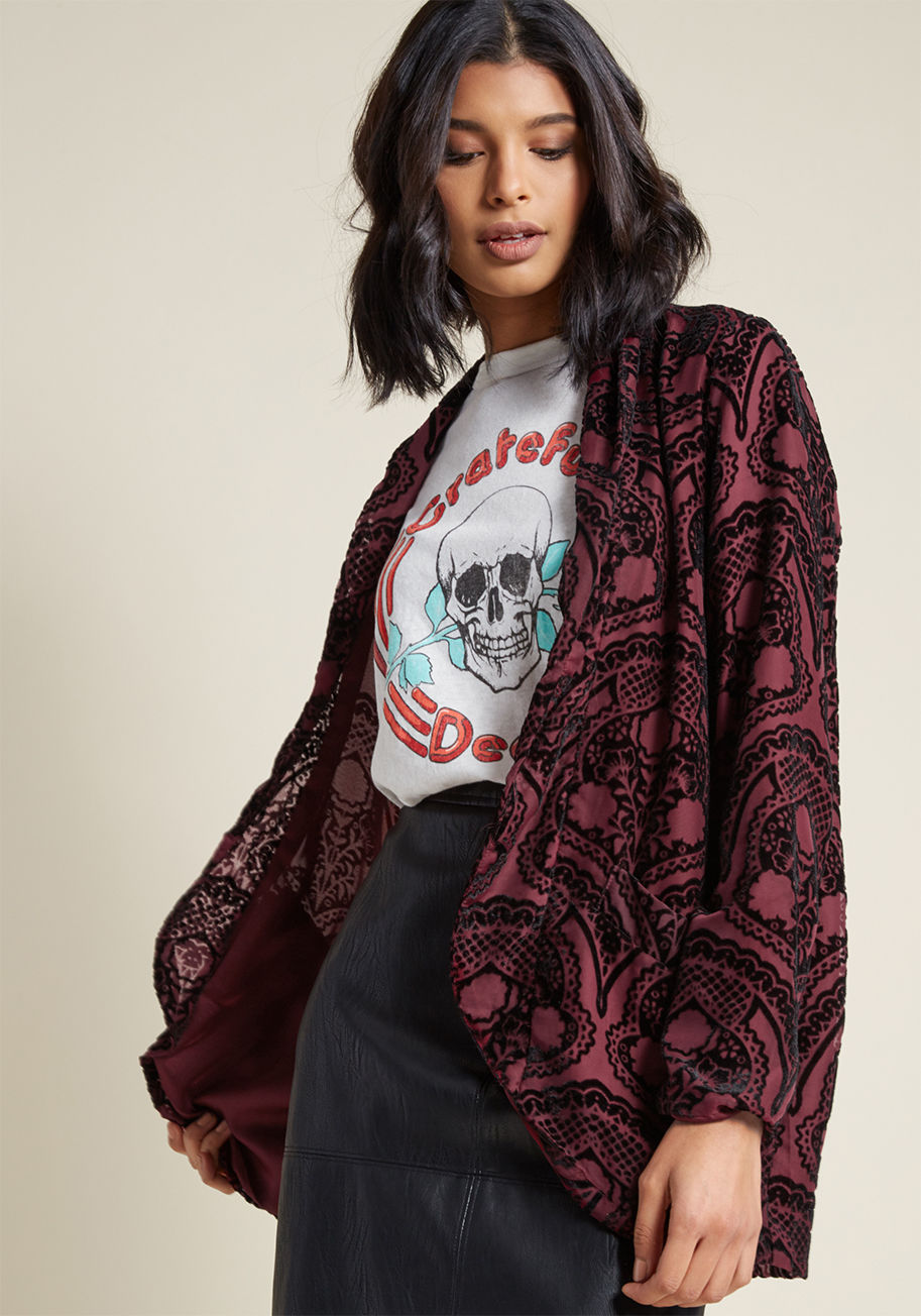 BH402422 - Right before heading out, toss on this burgundy jacket from BB Dakota for the ultimate finishing touch! Flocked from its draped lapels, to its long sleeves, down to its handy pockets with an ornate black design, this open-front layer is as lovely as it is