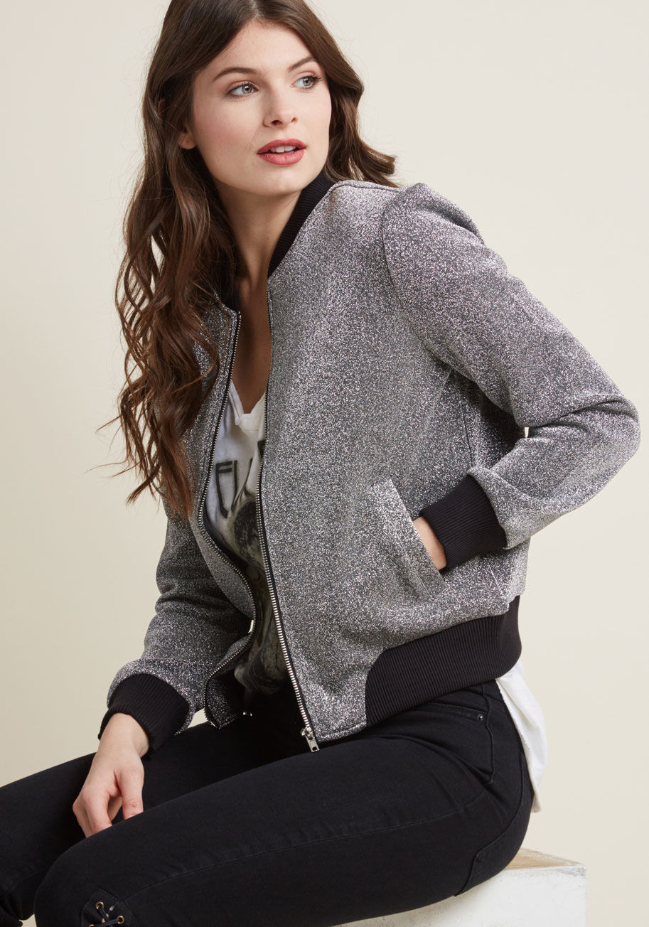 BH402451 - This metallic silver bomber jacket from BB Dakota will bring out so much of your boldness, you may just consider changing your middle name to 'aplomb'! Black, ribbed-knit trim frames the neckline, cuffs, and hem of this pocketed statement piece, polishing