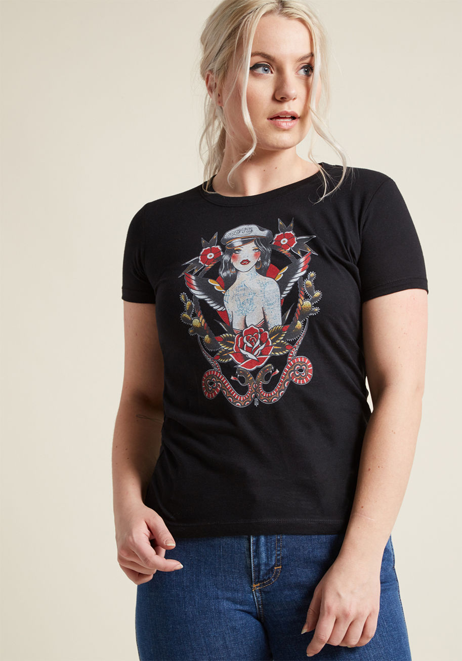 Biker Girl - Emulating the pin up queen atop this black graphic tee, you step out with a balanced boldness that everyone notices. This cotton T-shirt unlocks all the sass you have inside, courtesy of its old-school tattoo motif - a style of which others will 'ink' hig