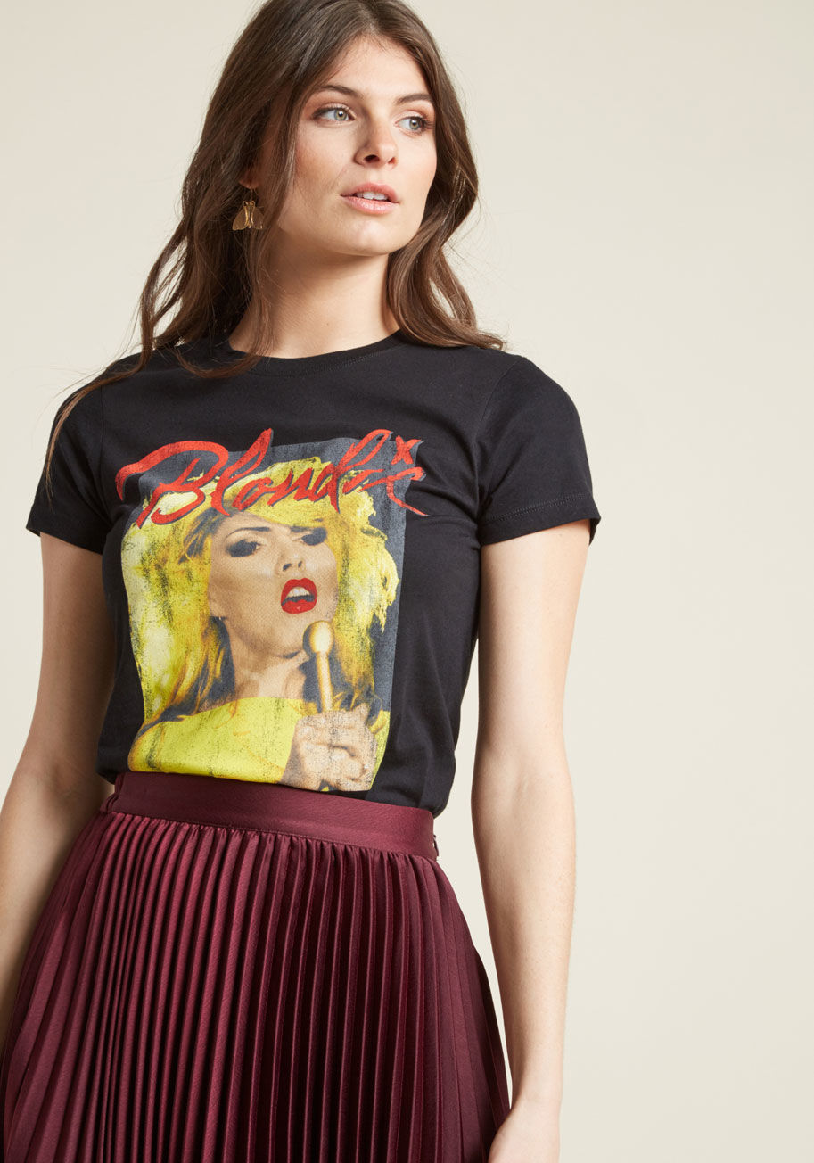 BLN0189-502BLK - This black graphic T-shirt incorporates colossal levels of cool! This short-sleeved shirt features a red-and-yellow Blondie screen print, featuring Debbie Harry looking done-up and divine. Rock this cotton tee to a concert, coffee shop, or casual night in