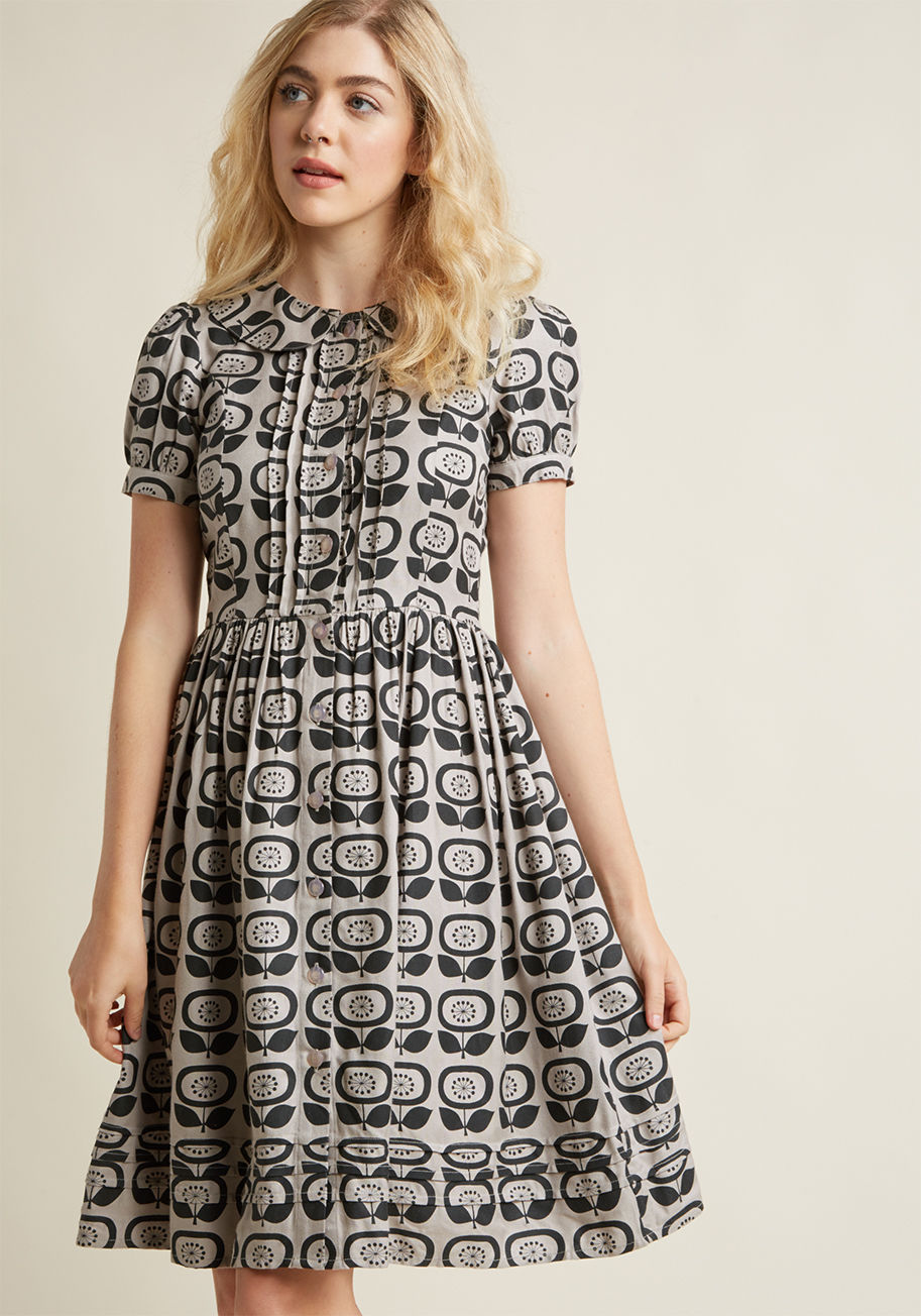 CD460 - Holy vivaciously vintage-inspired! This grey shirt dress is the epitome of old school appeal! Donning a rounded collar, pintucks accenting the button placket and hem, and puffed short sleeves, this ModCloth-exclusive midi - complete with the cutest black 