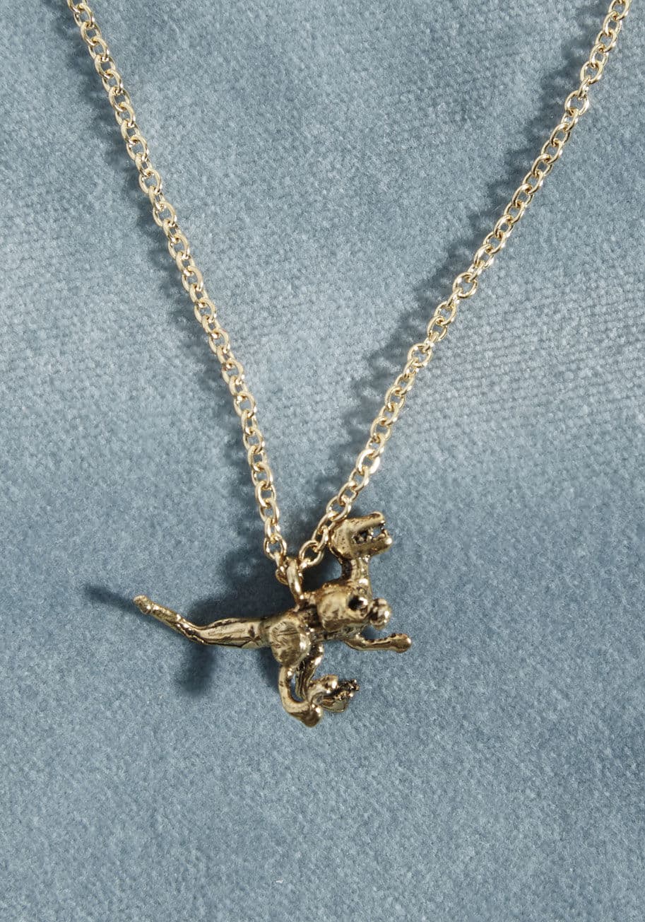 CH-Veloc-LG-BR - Catch you without this gold necklace on? Nonsense! This adorable accessory is one you'll flaunt with frequency, for its tiny, 3D printed Velociraptor pendant makes for an accent that you won't want to go without for even a minute.